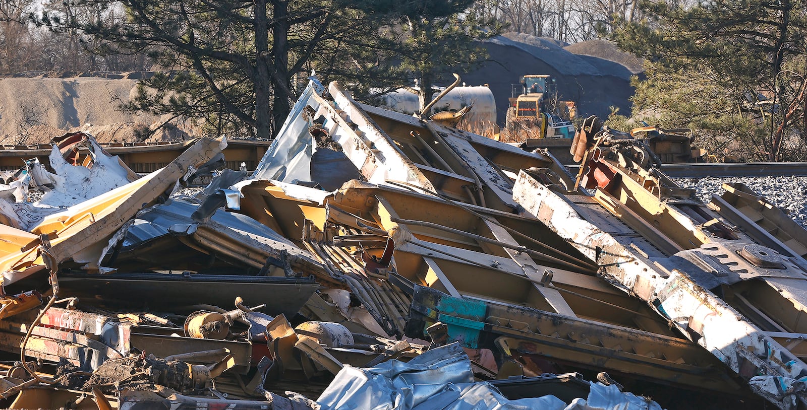 Work continues at the Norfolk Southern derailment site in Clark County as workers cut the remaining train cars into pieces to be hauled away Wednesday, March 15, 2023. BILL LACKEY/STAFF