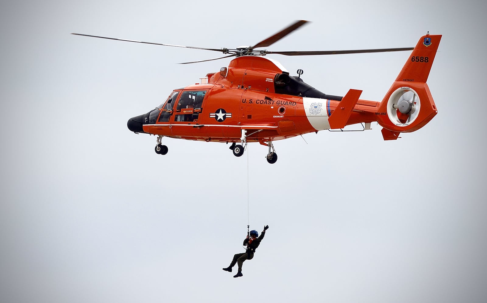 The United States Coast Guard does an exhibition flight at the Dayton Air Show on Sunday, June 23, 2024. MARSHALL GORBY / STAFF