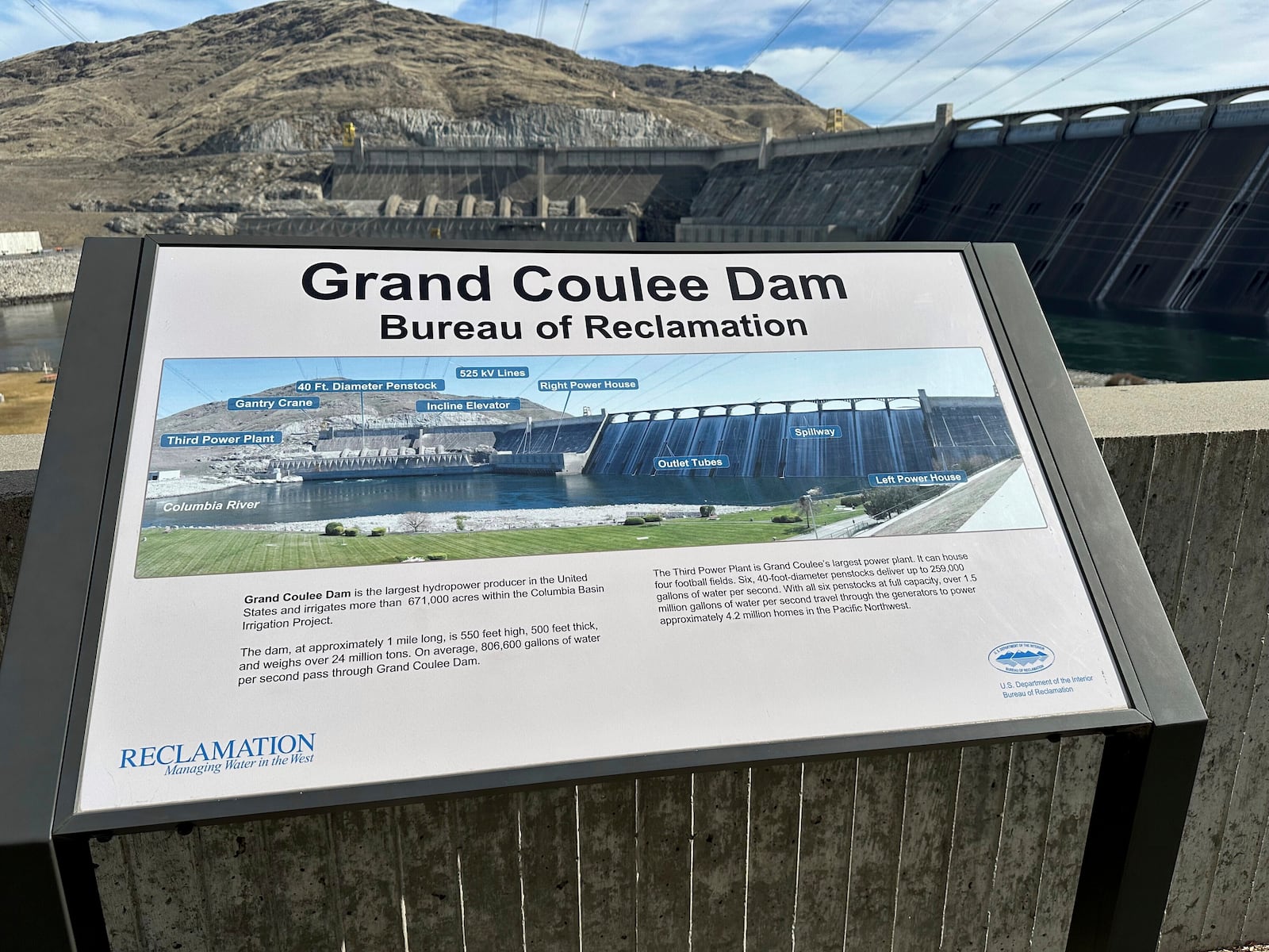 A sign outside the visitor’s center at the Grand Coulee Dam, the largest hydropower generator in North America, identifies the facility’s power plants and spillway on Friday, Feb. 28, 2025, in Coulee Dam, Wash. (AP Photo/Martha Bellisle)