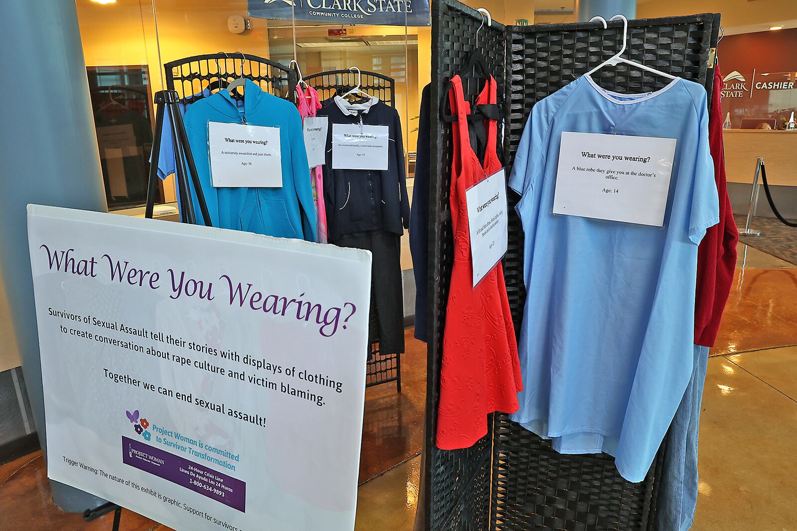 The "What Were You Wearing?" sexual assault exhibit on display in the Sara T. Landess Technology and Learning Center at Clark State Friday. BILL LACKEY/STAFF