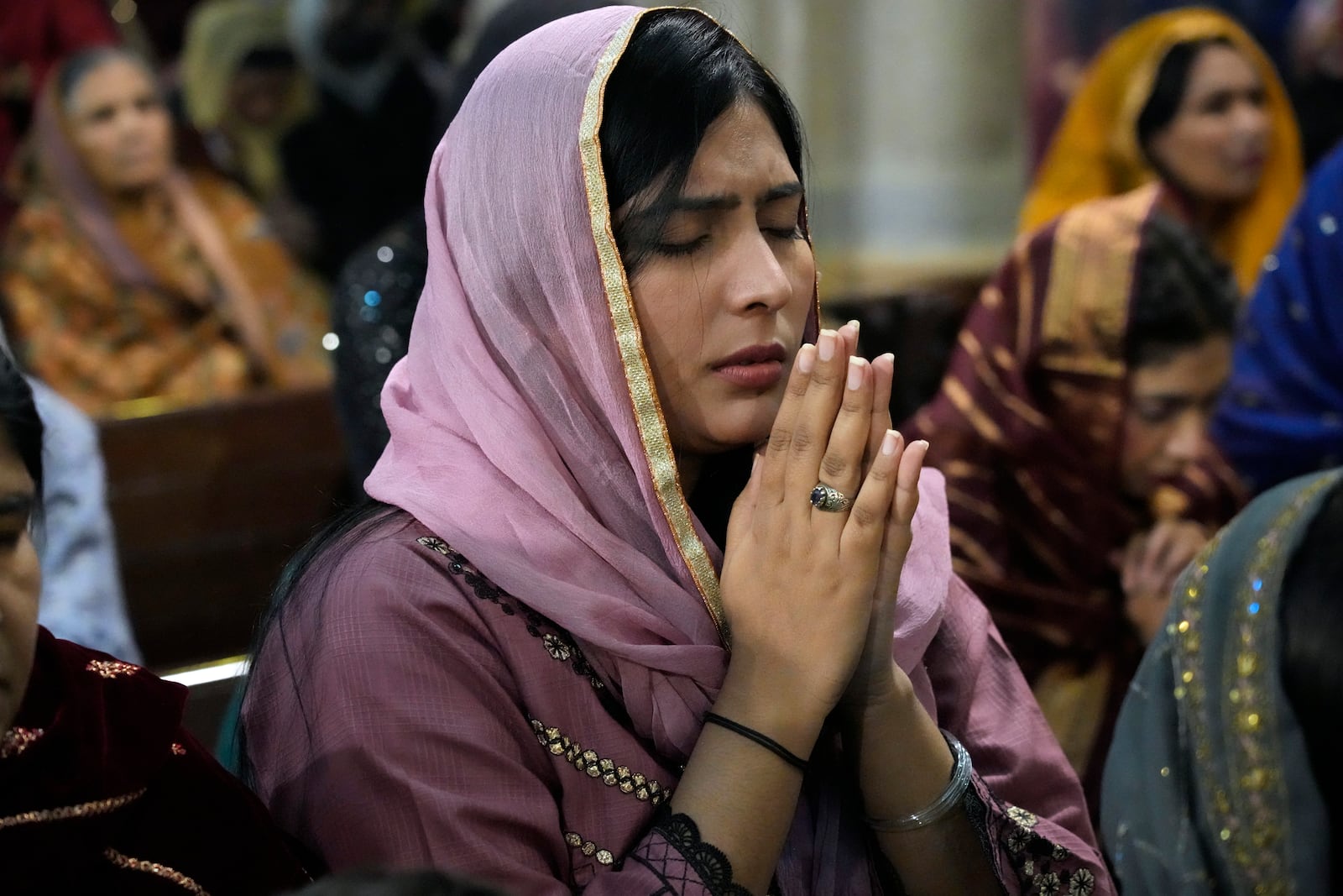 Christians attend the Christmas Mass at Sacred Heart Cathedral Church, in Lahore, Pakistan, Wednesday, Dec. 25, 2024. (AP Photo/K.M. Chaudary)