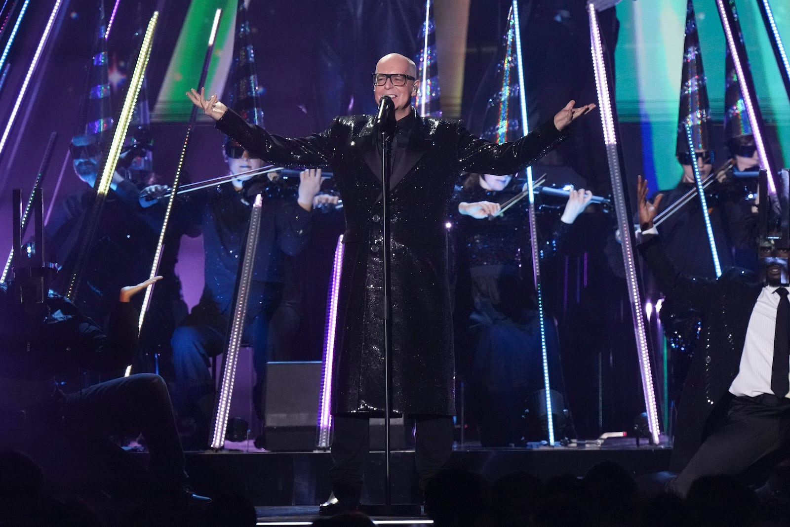 Neil Tennant from the 'Pet Shop Boys' performs alongside the Manchester Camerata during the MTV European Music Awards in Manchester, England, Sunday, Nov. 10, 2024. (Scott A Garfitt/Invision/AP)