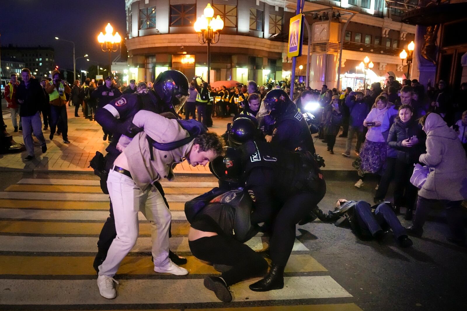 FILE - Riot police detain demonstrators at a protest in Moscow, Russia, Sept. 21, 2022, after President Vladimir Putin ordered a partial mobilization of reservists for the conflict in Ukraine. (AP Photo, File)