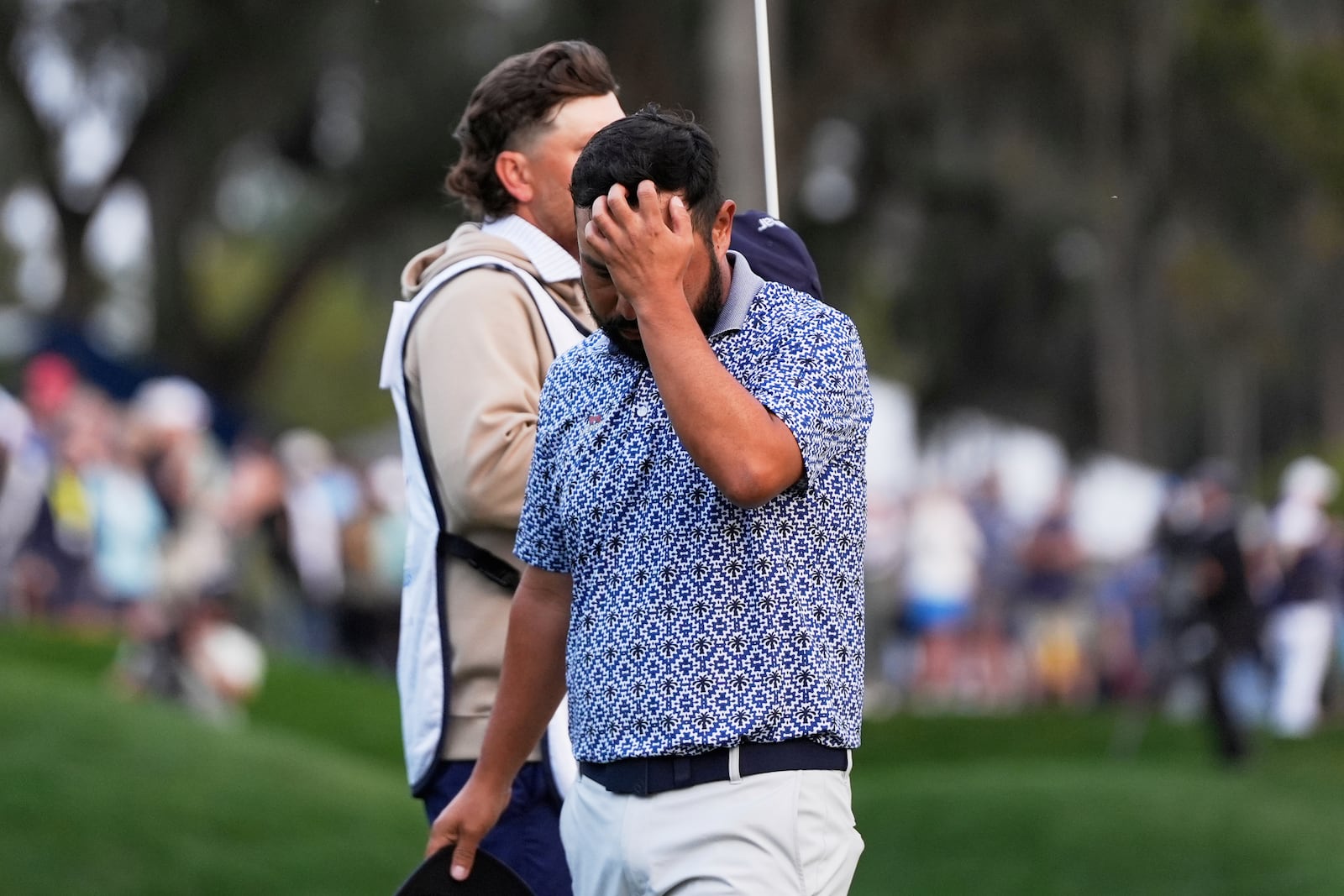 J.J. Spaun reacts after a putt on the 18th green during the final round of The Players Championship golf tournament Sunday, March 16, 2025, in Ponte Vedra Beach, Fla. (AP Photo/Julia Demaree Nikhinson)