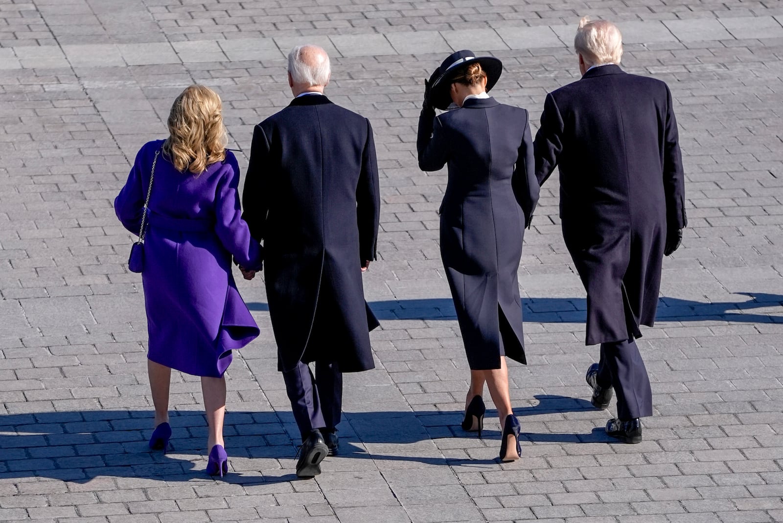 President Donald Trump, from right, and first lady Melania Trump walk with former President Joe Biden and Jill Biden to board a Marine helicopter as the Bidens depart to Joint Base Andrews after the 60th Presidential Inauguration, Monday, Jan. 20, 2025, at the U.S. Capitol in Washington. (Jack Gruber/Pool Photo via AP)