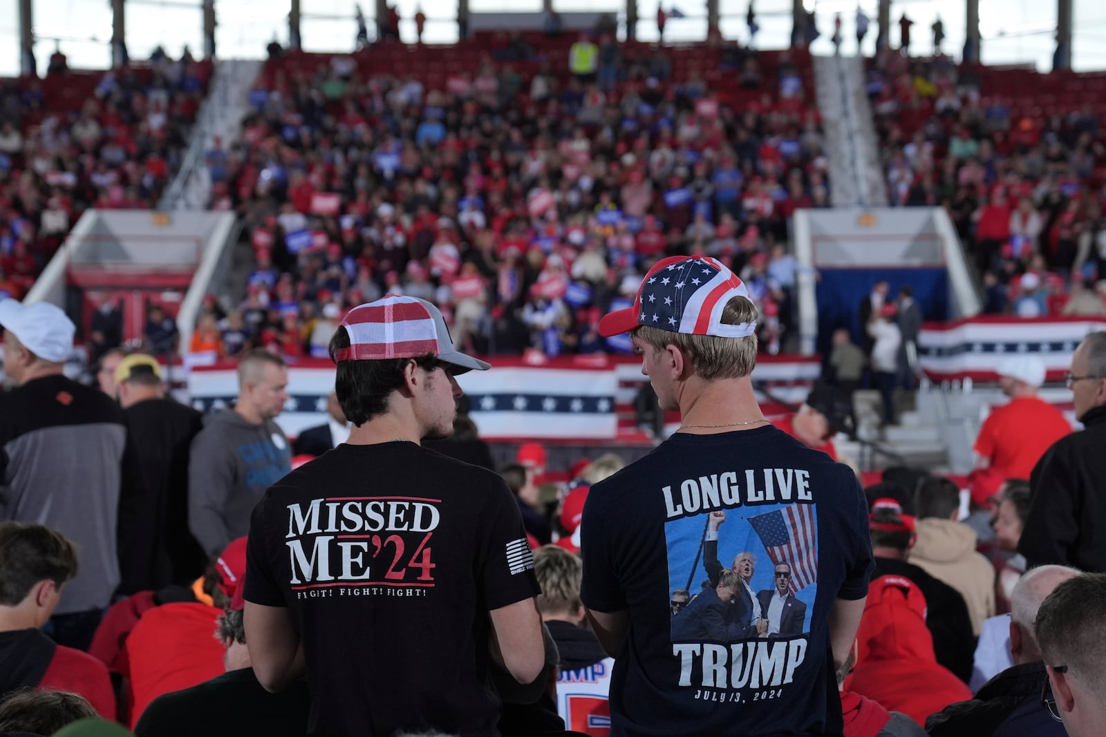 Supporters arrive before Republican presidential nominee former President Donald Trump arrives to speak to a campaign rally at J.S. Dorton Arena, Monday, Nov. 4, 2024, in Raleigh, N.C. (AP Photo/Evan Vucci)