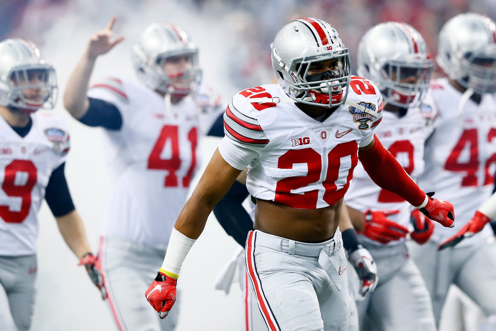 NEW ORLEANS, LA - JANUARY 01:  Ohio State Buckeye players run onto the field prior to the start of the game during the All State Sugar Bowl at the Mercedes-Benz Superdome on January 1, 2015 in New Orleans, Louisiana.  (Photo by Kevin C. Cox/Getty Images)