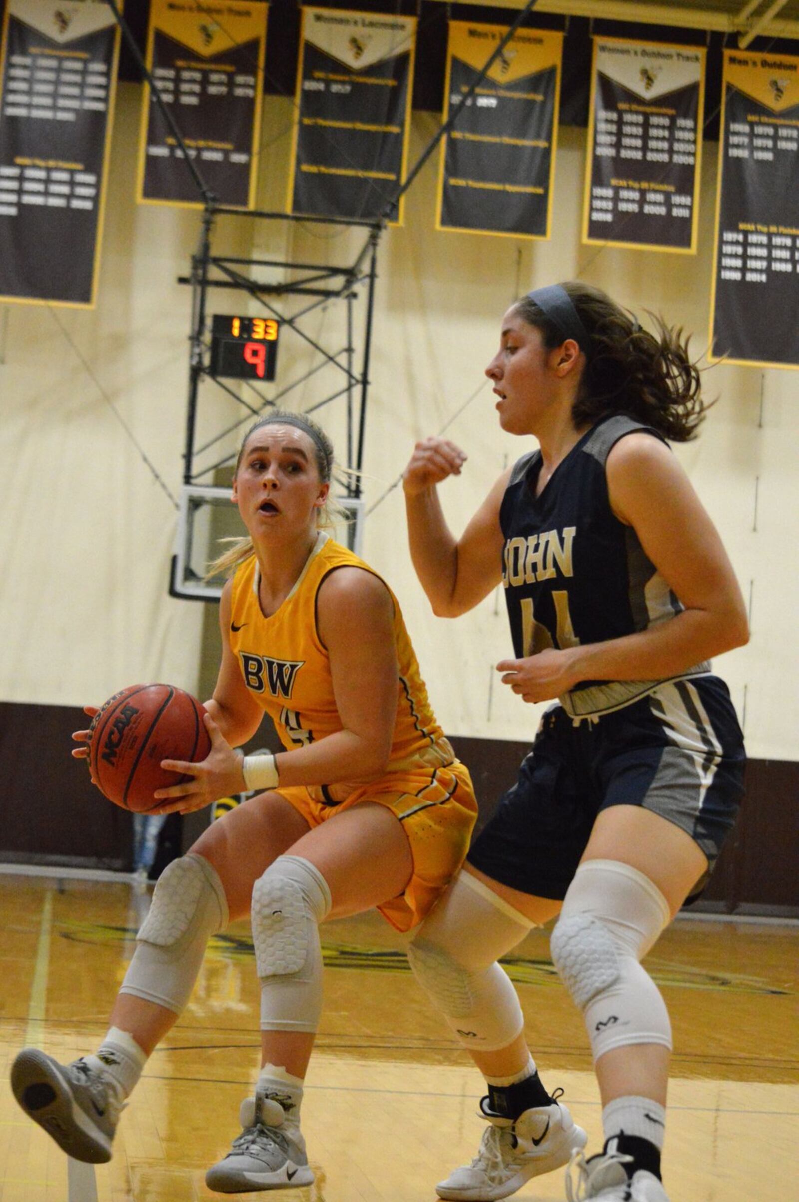 Baldwin Wallace’s Kasey Hughes (left) looks for a shot in the lane against John Carroll on Feb. 12, 2020, in Berea. Hailey Owens/CONTRIBUTED