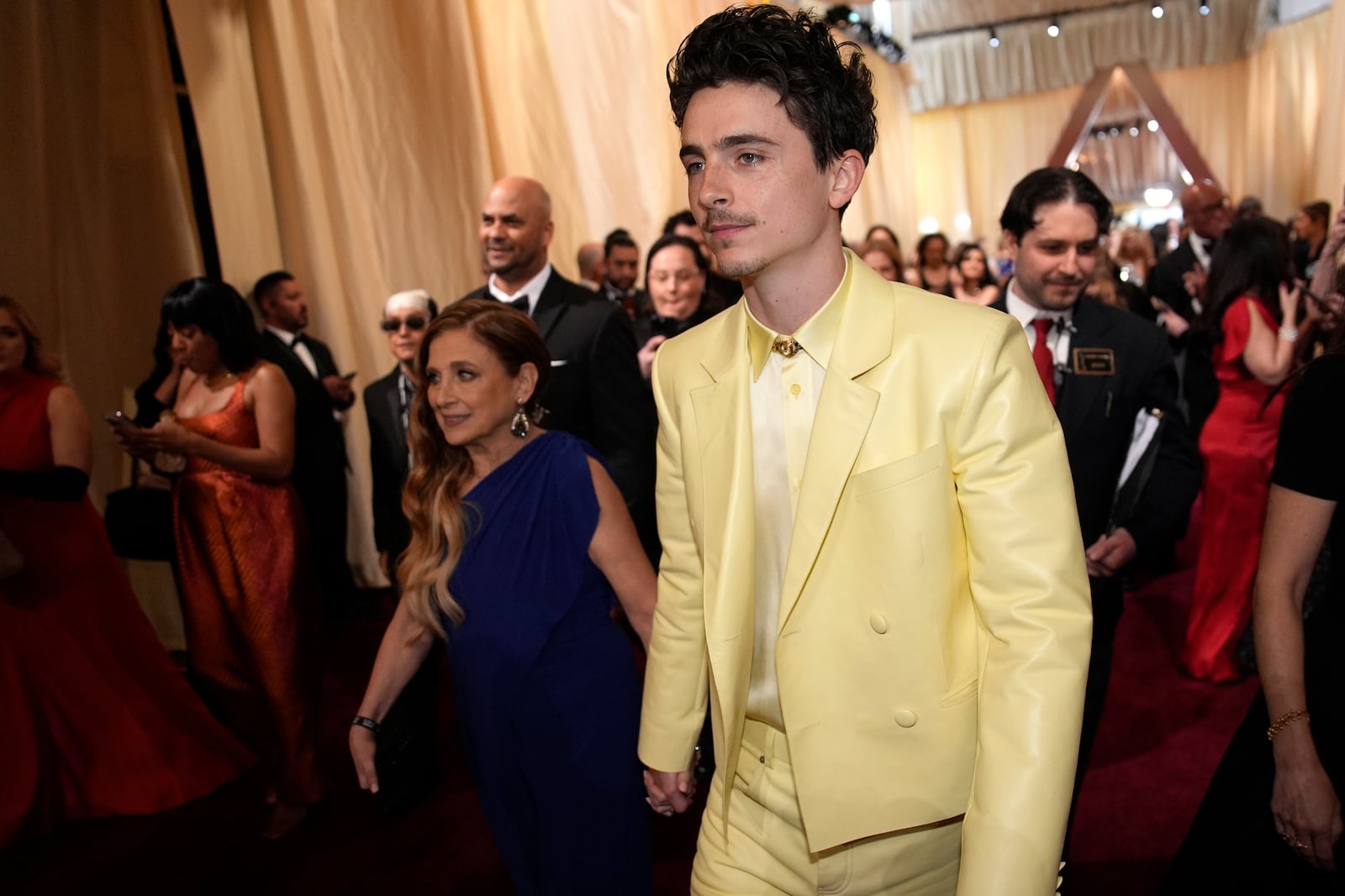 Nicole Flender, left, and Timothée Chalamet arrive at the Oscars on Sunday, March 2, 2025, at the Dolby Theatre in Los Angeles. (AP Photo/John Locher)