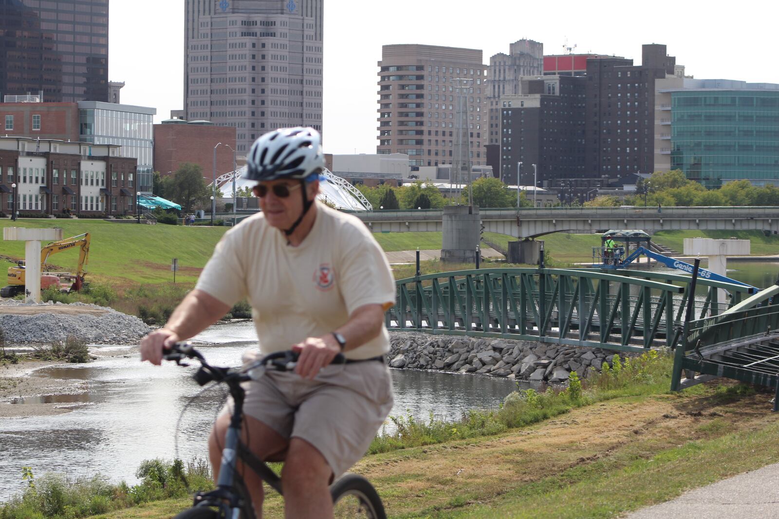 A bicyclist travels along a bike path near Deed's Point MetroPark near downtown Dayton last year. CORNELIUS FROLIK / STAFF