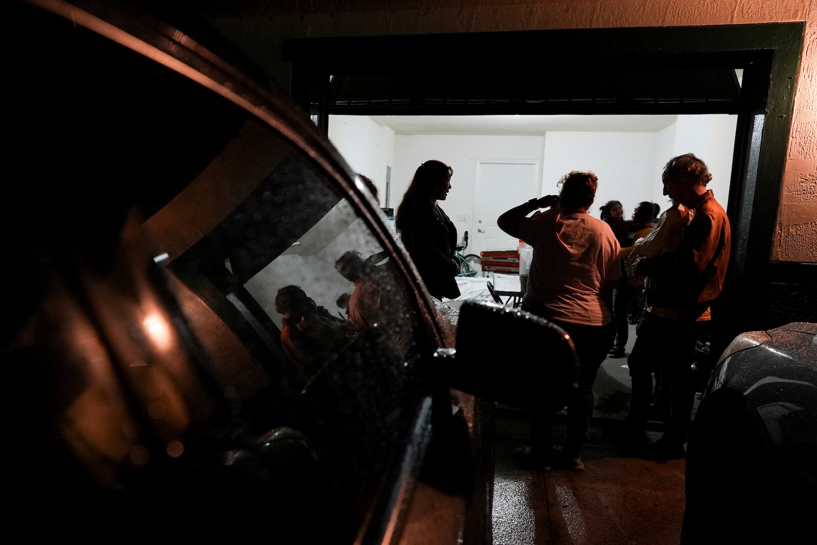 Nora Sandigo, center left, who runs a non-profit dedicated to supporting immigrant families, speaks with a group of mothers worried about the possibility of being deported, to educate them about their legal rights and options to proctect their families, Friday, Jan. 17, 2025, in Florida City, Fla. (AP Photo/Rebecca Blackwell)