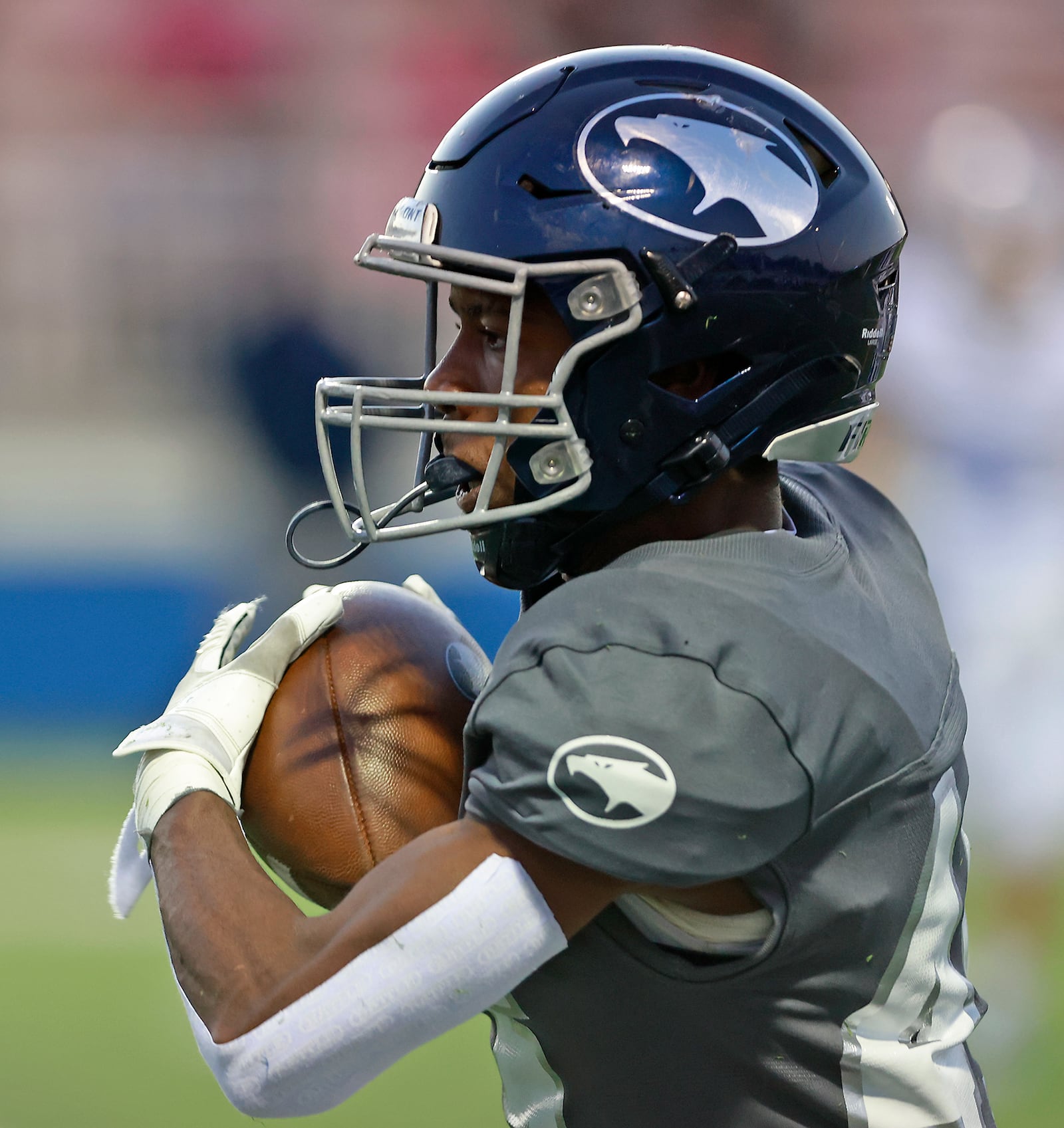 Fairmont's Kameron Thornton catches a pass as he runs down the sideline on his way to a touchdown. BILL LACKEY/STAFF