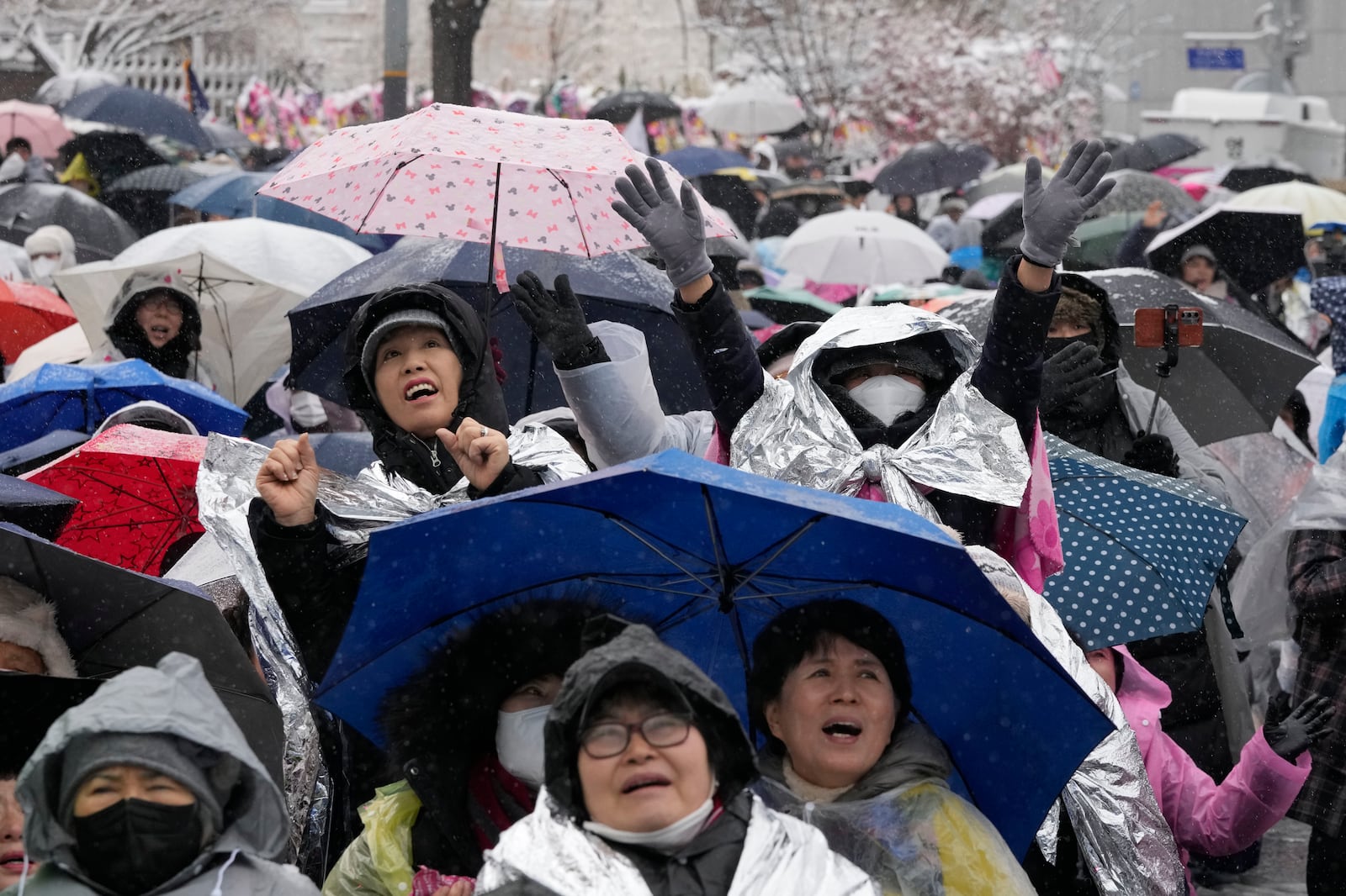 Supporters of impeached South Korean President Yoon Suk Yeol attend a Sunday service as they gather to oppose his impeachment near the presidential residence in Seoul, South Korea, Sunday, Jan. 5, 2025. (AP Photo/Ahn Young-joon)