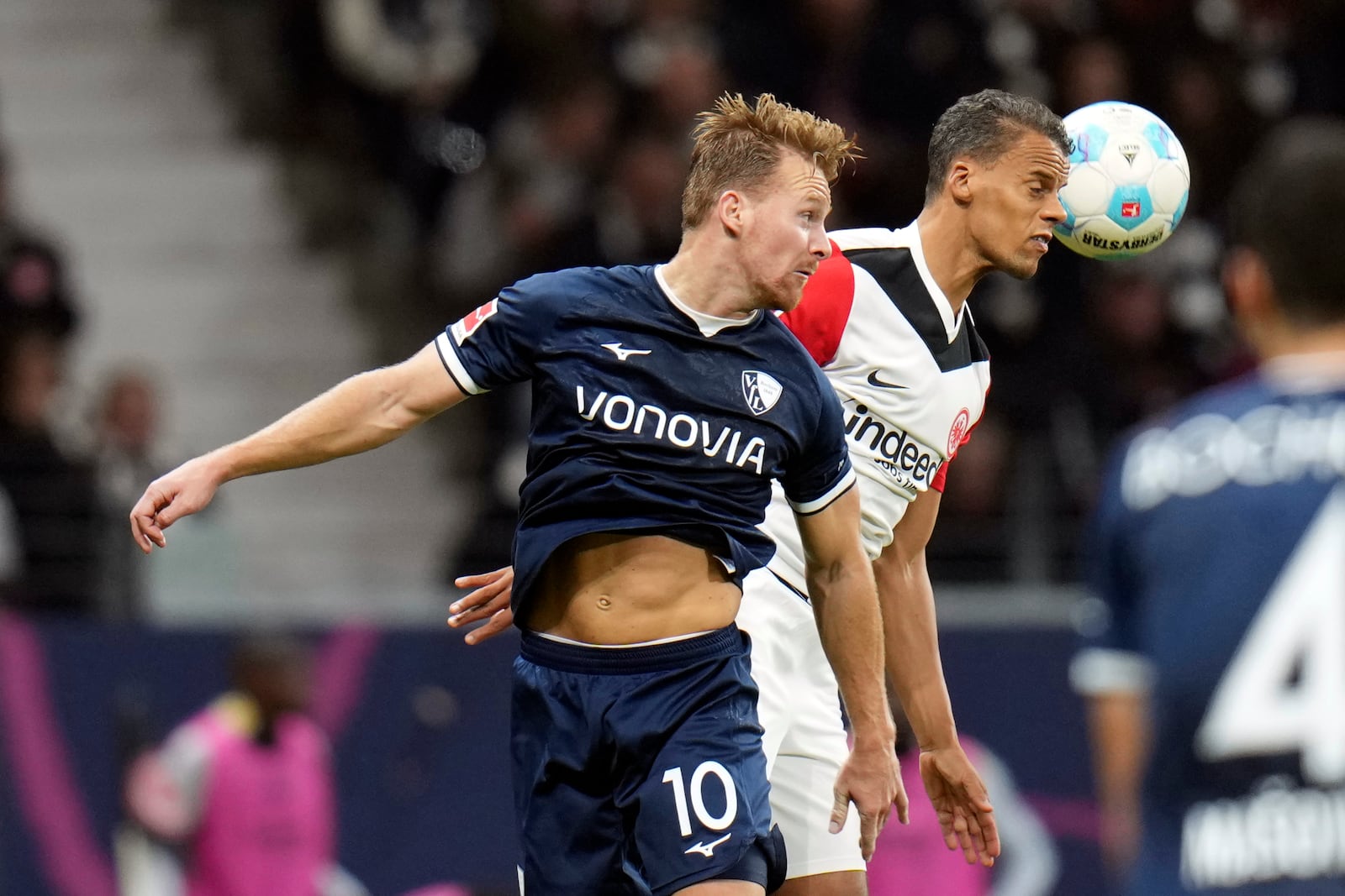 Bochum's Dani de Wit, left, and Frankfurt's Timothy Chandler heading a ball during the German Bundesliga soccer match between Eintracht Frankfurt and VfL Bochum at Deutsche Bank Park stadium in Frankfurt, Germany, Saturday Nov. 2, 2024. (Thomas Frey/dpa via AP)