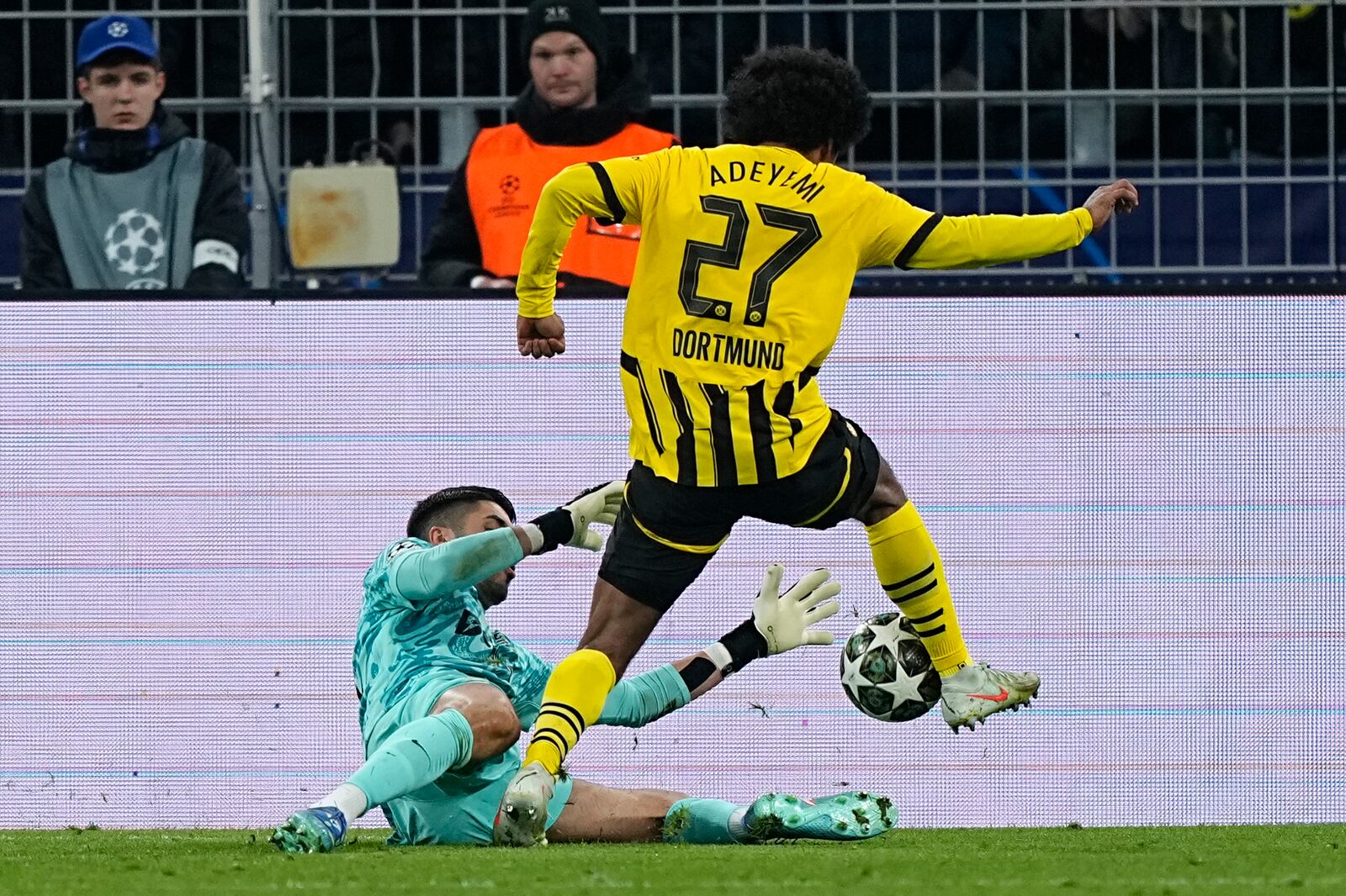 Sporting's goalkeeper Rui Silva fouls Dortmund's Karim Adeyemi inside the penalty box during the Champions League playoff second leg soccer match between Borussia Dortmund and Sporting CP at the Signa-Iduna Park in Dortmund, Germany, Wednesday, Feb. 19, 2025. (AP Photo/Martin Meissner)