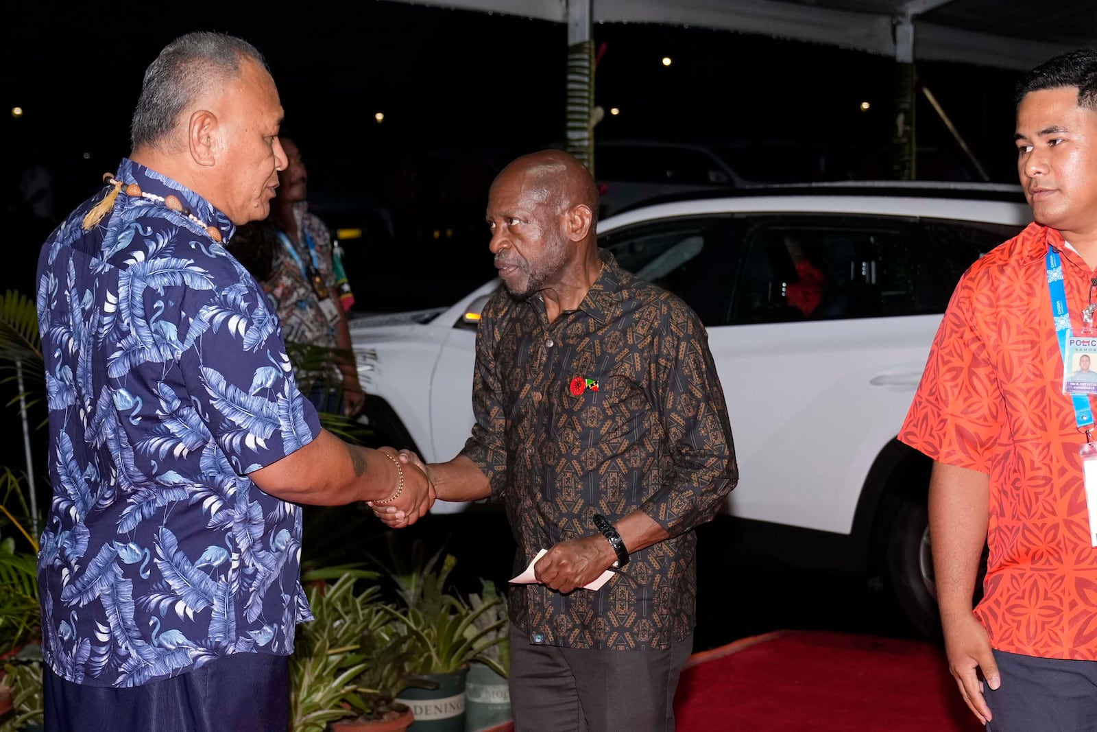 Denzil Douglas, Minister of Foreign Affairs of Saint Kitts and Nevis, center, arrives at the official welcome reception for the Commonwealth Heads of Government meeting in Apia, Samoa, Thursday, Oct. 24, 2024. (AP Photo/Rick Rycroft/Pool)