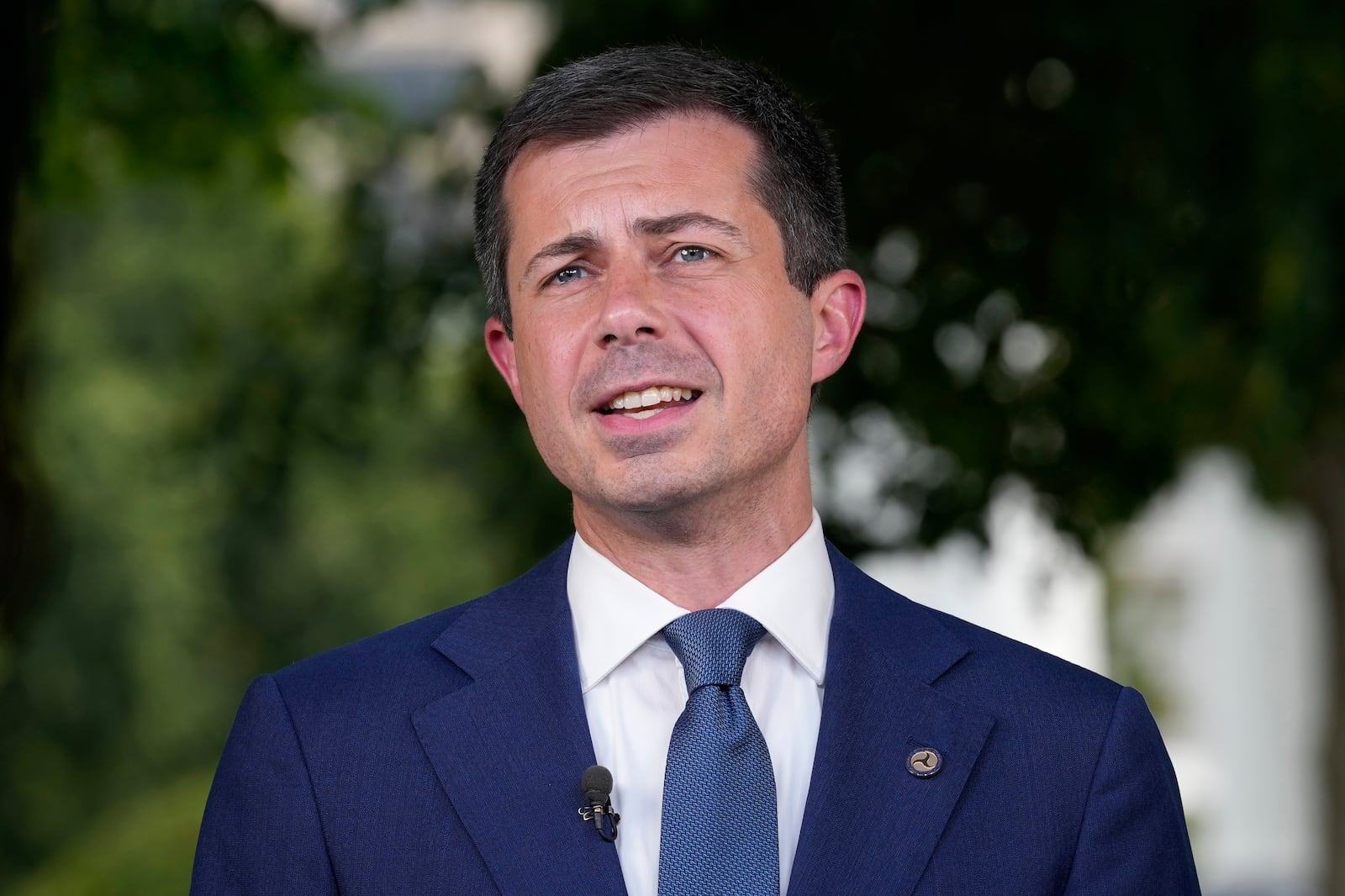 FILE - Transportation Secretary Pete Buttigieg talks with reporters at the White House in Washington, July 23, 2024. (AP Photo/Susan Walsh, FIle)