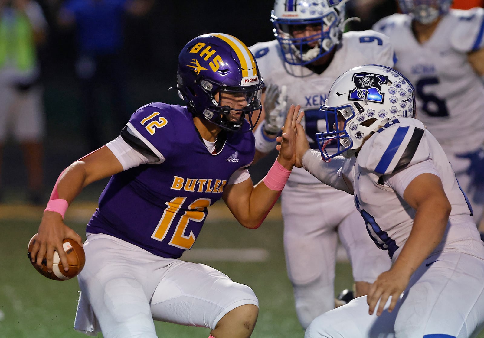 Butler quarterback Mason Reckner is sacked by Xenia's Ronnie Butler during a game this season. BILL LACKEY/STAFF