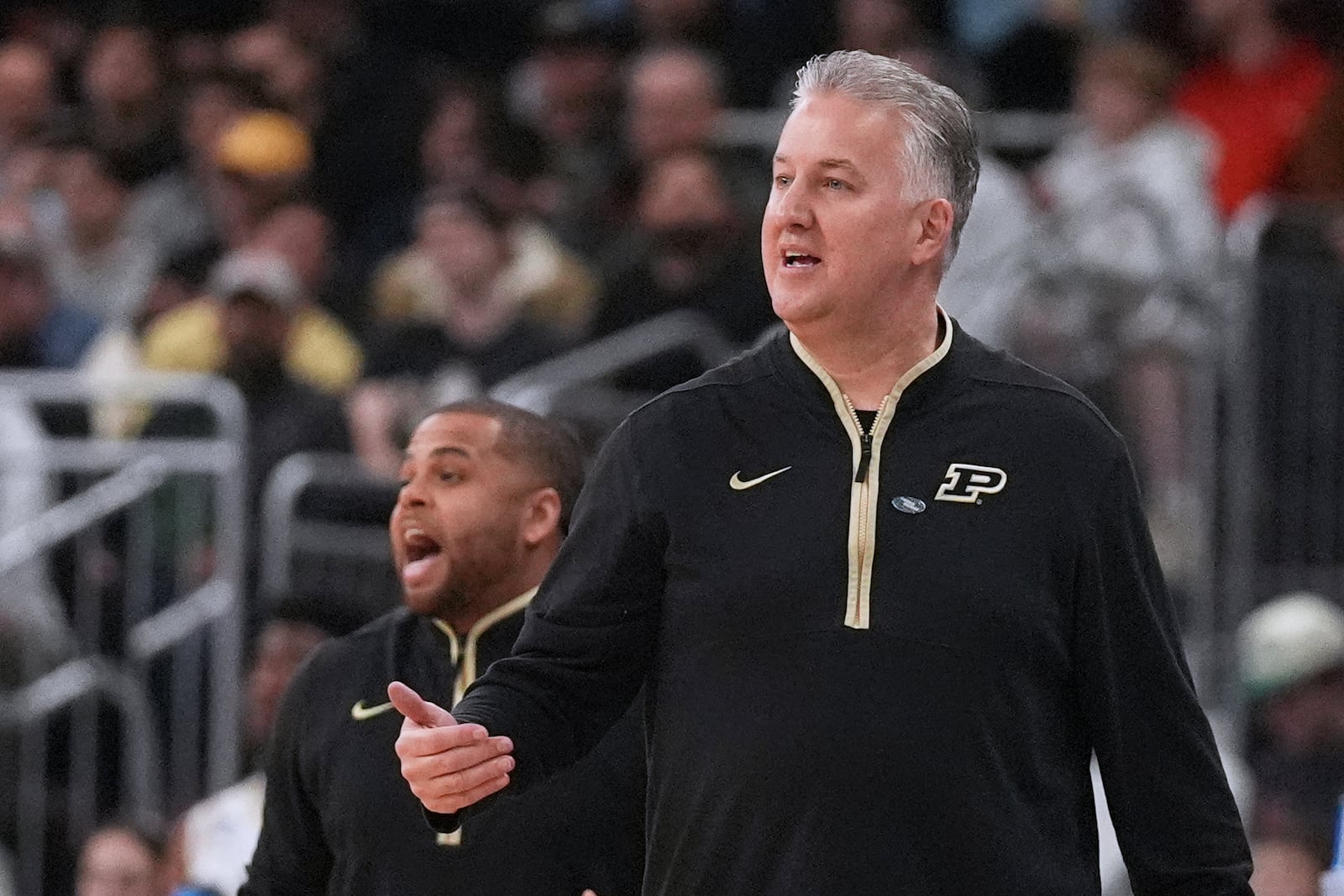 Purdue head coach Matt Painter calls to his players during the first half in the first round of the NCAA college basketball tournament, Thursday, March 20, 2025, in Providence, R.I. (AP Photo/Charles Krupa)