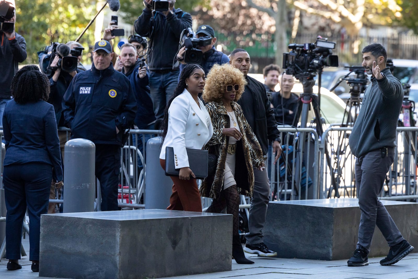 Janice Combs, right, mother of Sean "Diddy Combs, arrives at Manhattan federal court, Thursday, Oct. 10 2024, in New York. (AP Photo/Yuki Iwamura)