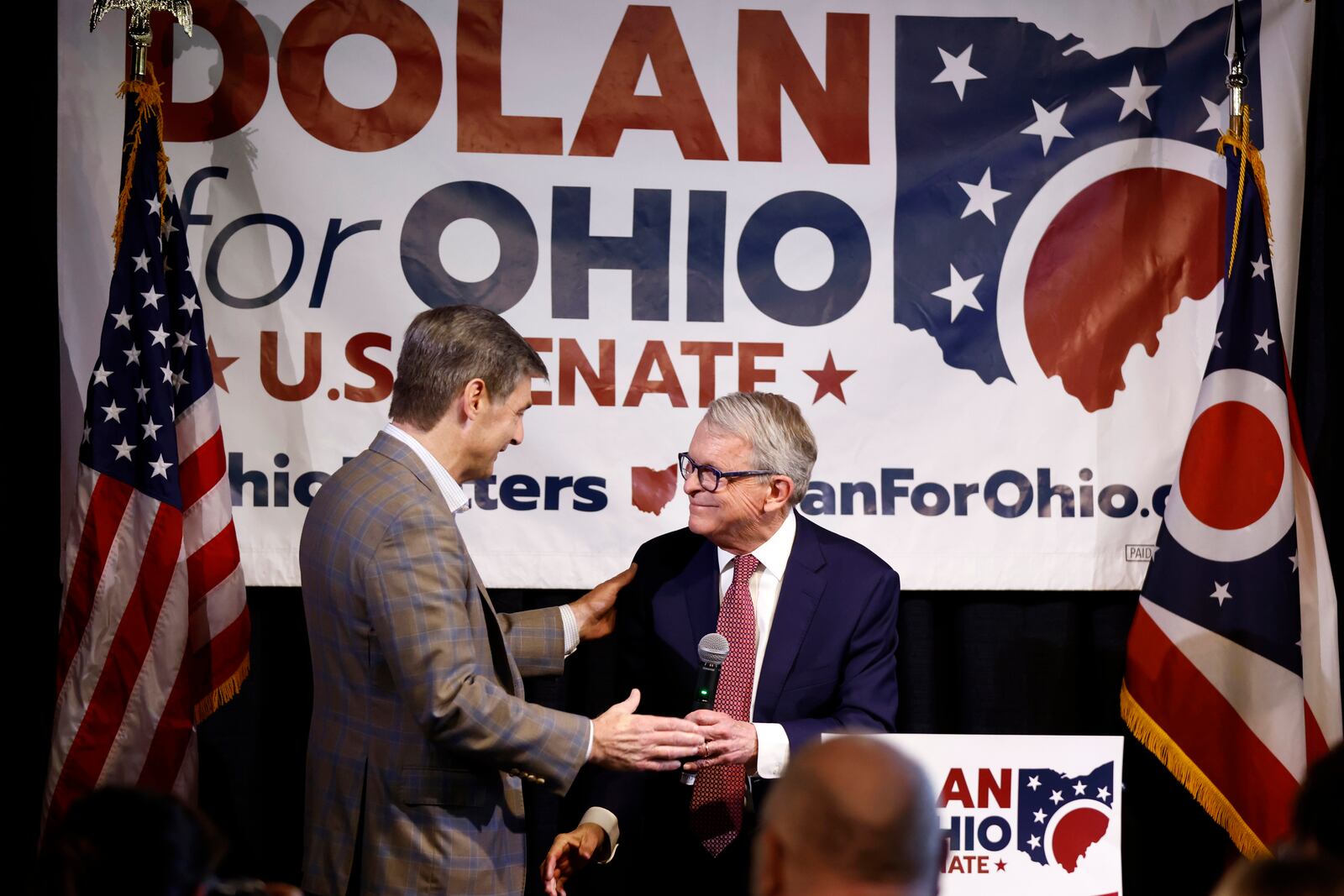 Ohio governor Mike DeWine, right, greets Ohio state senator and Republican candidate for U.S. Senate Matt Dolan during a campaign event in Columbus, Ohio, Monday, March 18, 2024. (AP Photo/Paul Vernon)