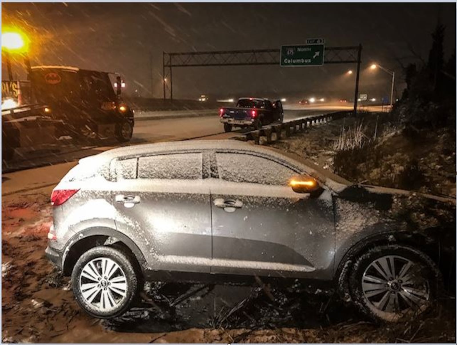 This vehicle hit the guardrail on I-75 South, near I-675, in Miami Twp. on Thursday night. (Jim Noelker/Staff)