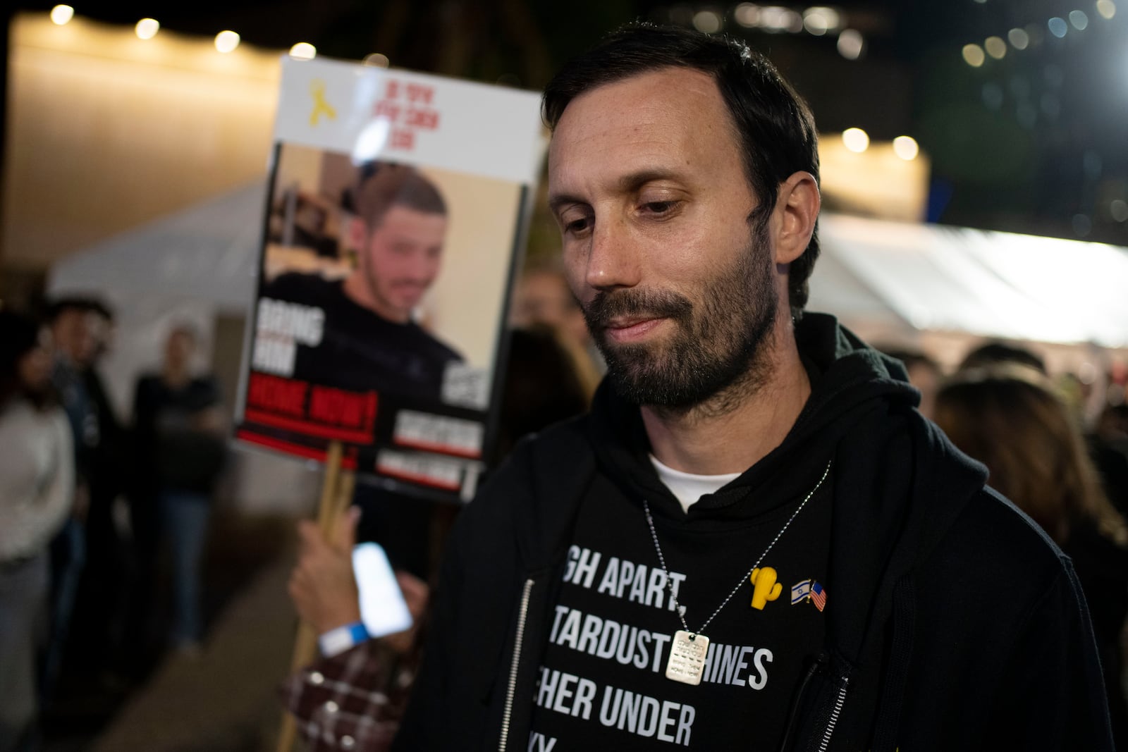 Daniel Lifshitz, grandson of Oded Lifshitz, who was taken hostage on Oct. 7, 2023, and held by Hamas militants in the Gaza Strip, is seen at a rally for hostages and their families in Tel Aviv, Israel, on Tuesday, Jan. 14, 2025. (AP Photo/Maya Alleruzzo)