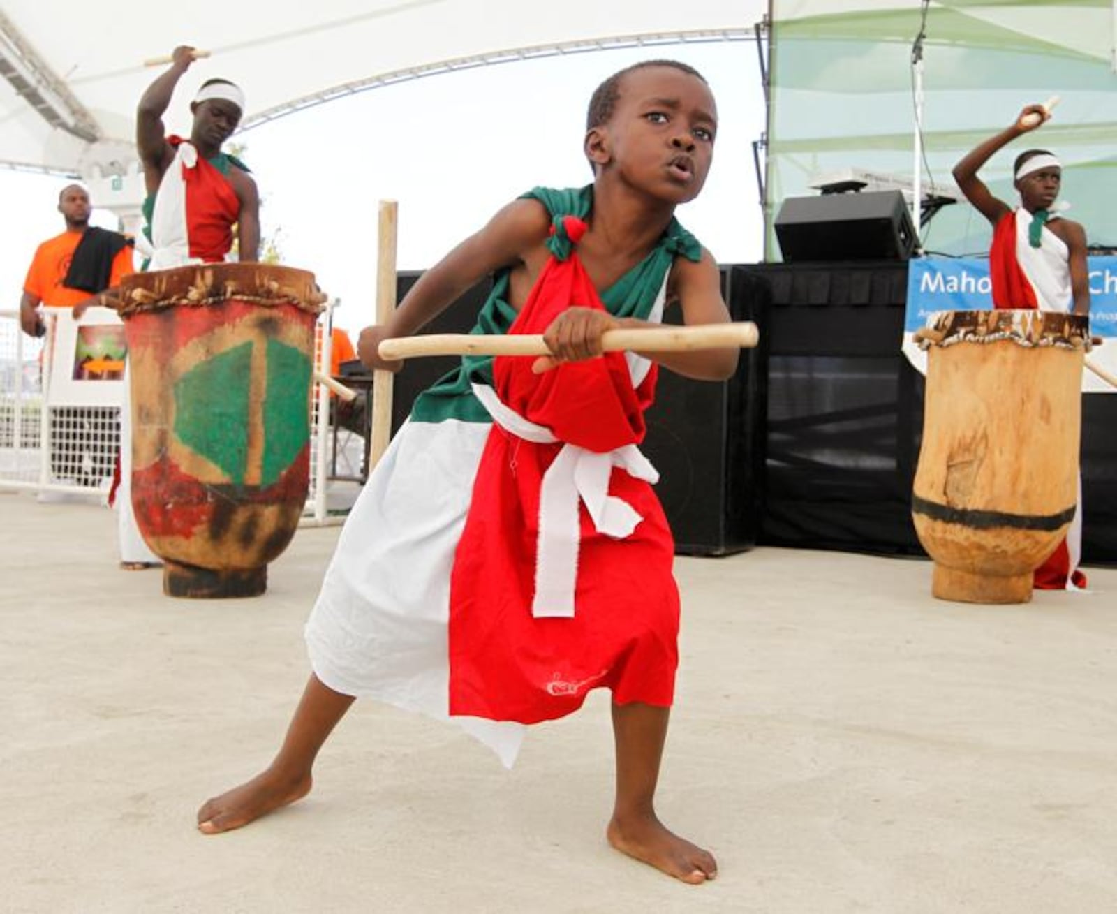 Pascal Ndayishimi, 6, dances with the Burundian Royal Court Drummers during the opening ceremony of the annual Dayton African American Cultural Festival. Barbara J. Perenic/Staff