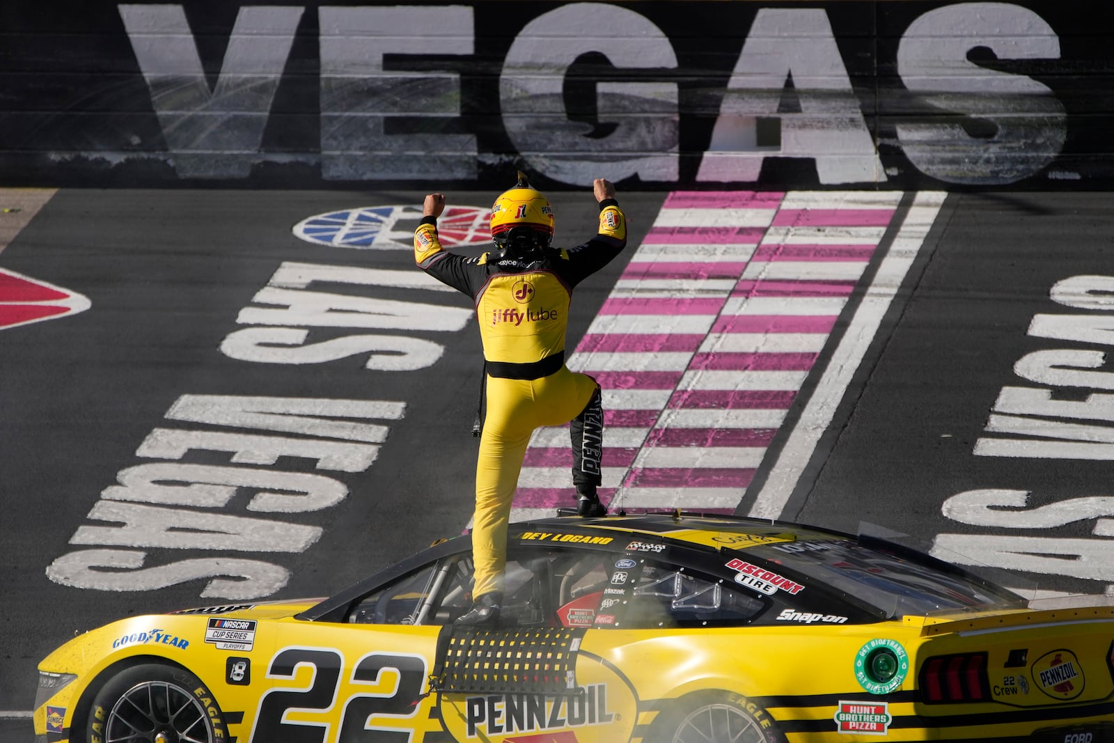 NASCAR Cup Series driver Joey Logano (22) celebrates after winning a NASCAR Cup Series auto race Sunday, Oct. 20, 2024, in Las Vegas. (AP Photo/John Locher)