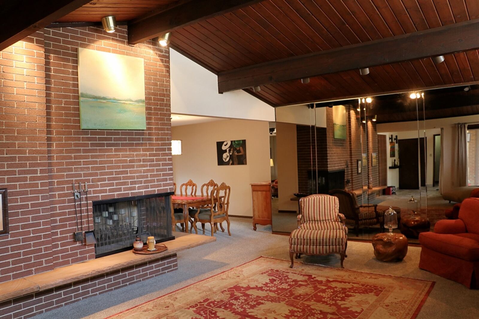 The formal living room has a wood-beam cathedral ceiling with knotty-pine wood planks. CONTRIBUTED BY KATHY TYLER 