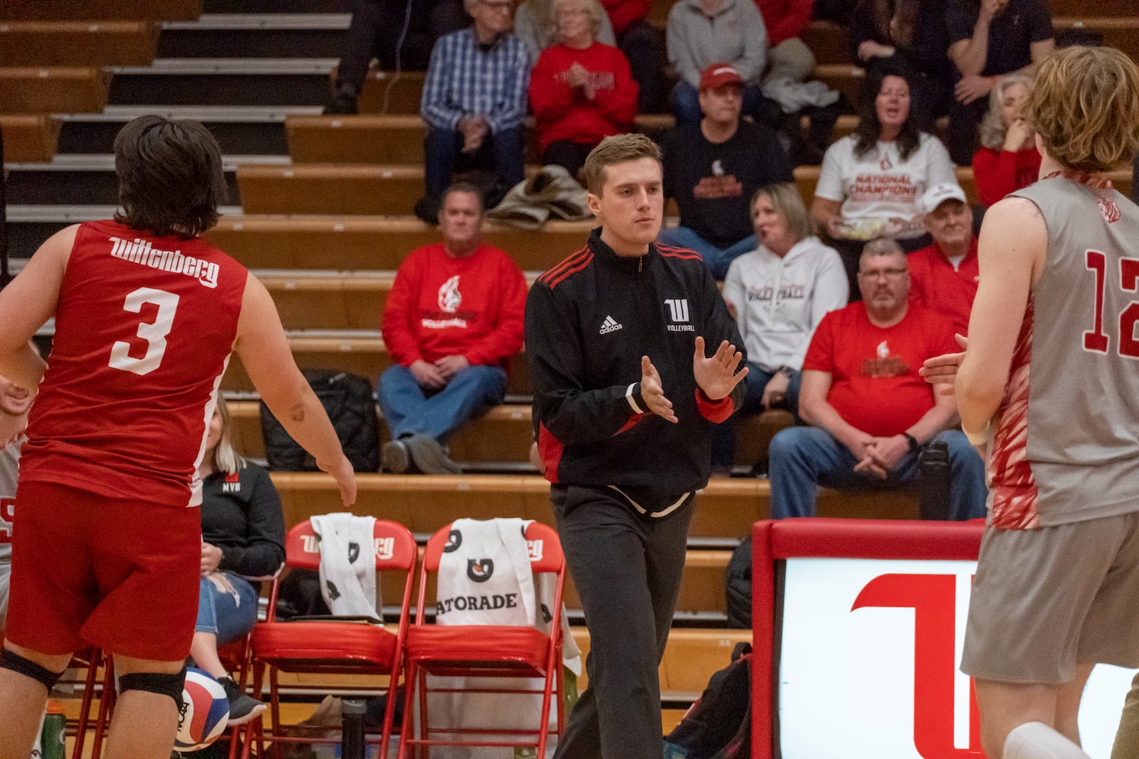 Wittenberg men's volleyball coach Nathan Matthews claps during a match in 2023. Photo courtesy of Wittenberg