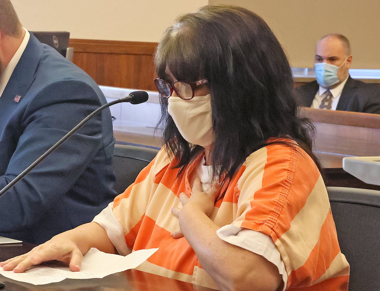 Valerie Rider reads a statment during the sentencing for her murder conviction in Champaign County Common Pleas Court Thursday. The victim's father, Charles Hostler, is listening in the background. BILL LACKEY/STAFF