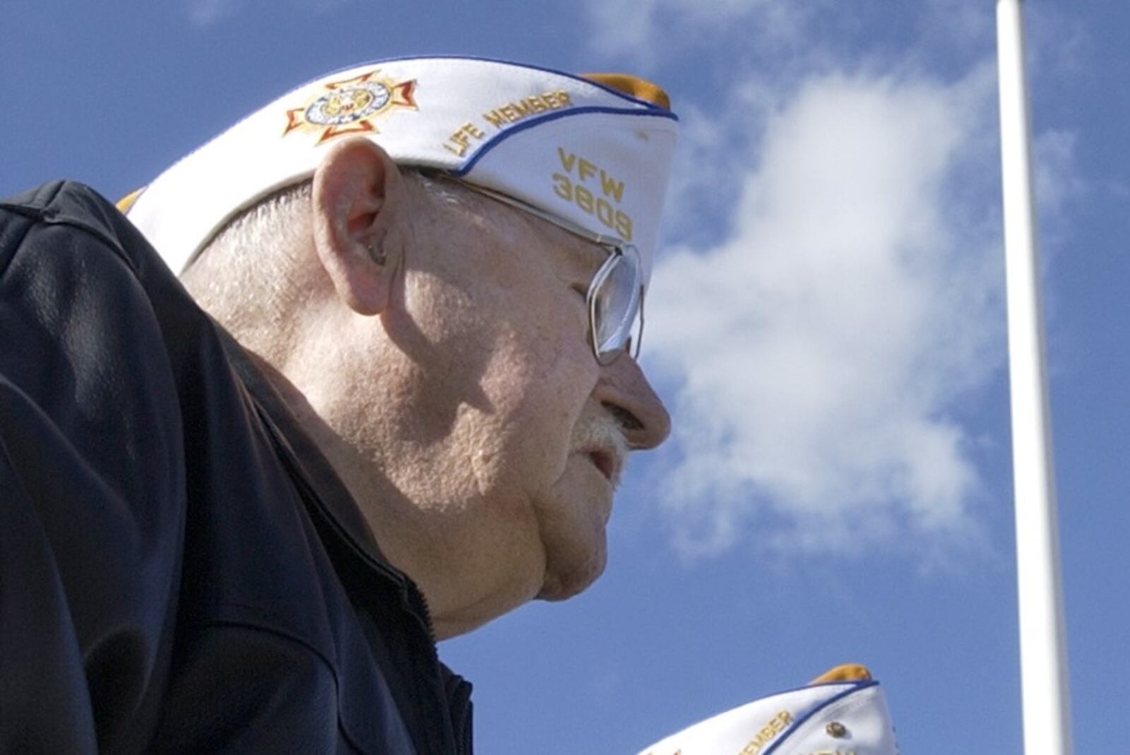 Albert Kemmerling participates in the annual observance of the attack on Pearl Harbor in Middletown, Ohio Tuesday Dec. 7, 2004. He served in the U.S. military and was stationed at Pearl Harbor at the time of the attack. (AP Photo/Middletown Journal, Pat Auckerman)