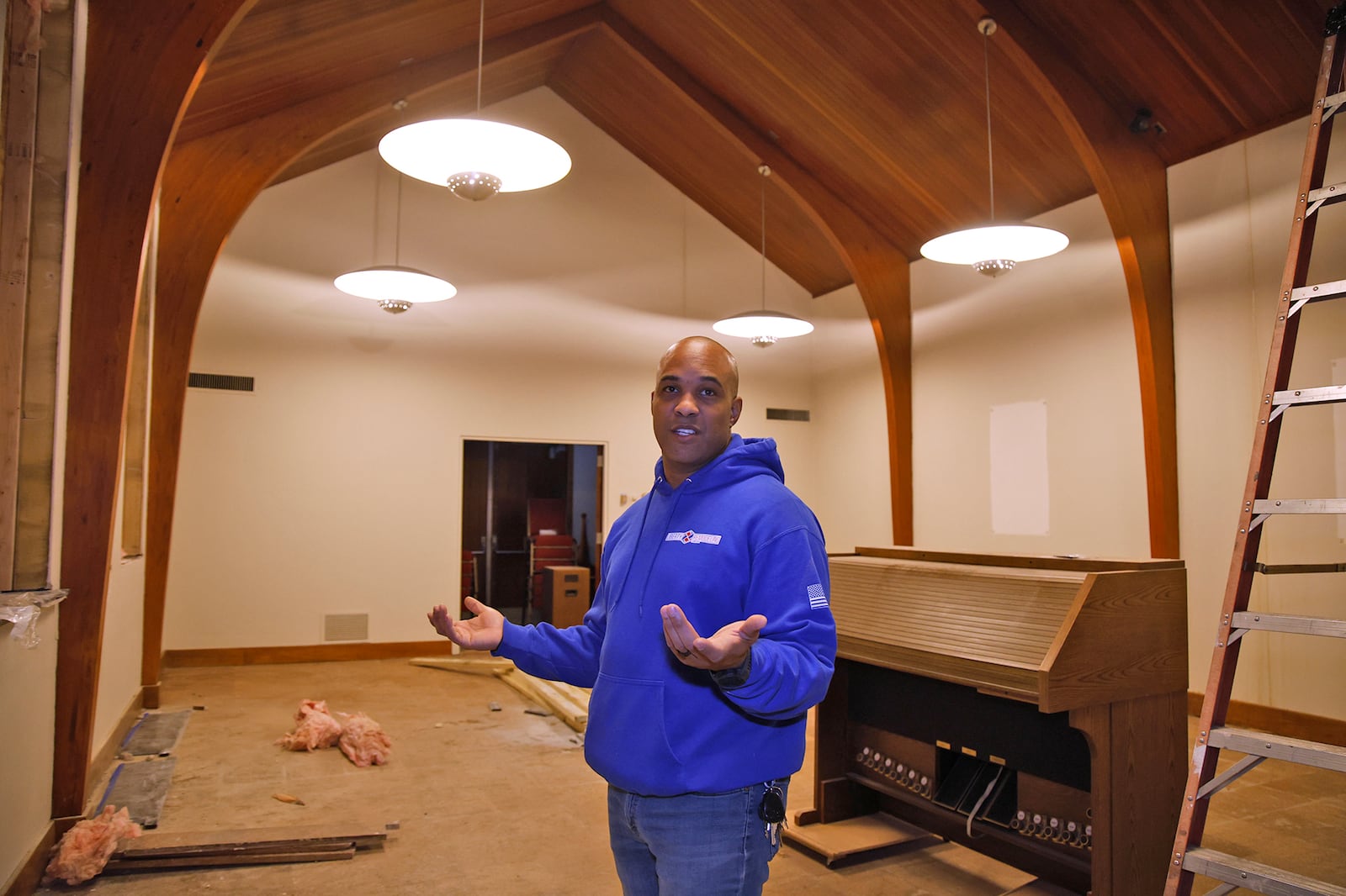 Levi Duncan talks about a small chapel that's being renovated in the former Central Methodist Episcopal Church 102 W. High St., Springfield. BILL LACKEY/STAFF