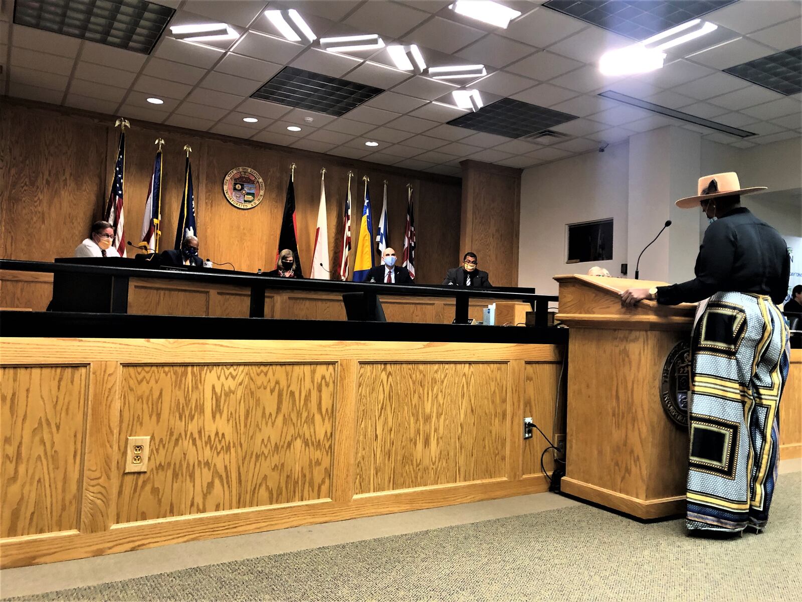 Sadé Diké speaks at a Dayton City Commission meeting about its federal rescue funds. CORNELIUS FROLIK / STAFF