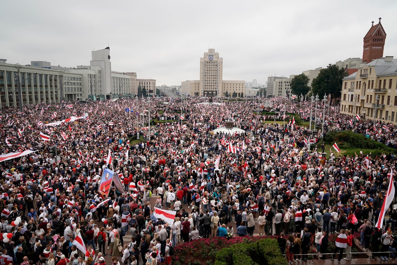 FILE – Supporters of the Belarusian opposition hold a rally in Independence Square in Minsk, Belarus, Aug. 23, 2020. (AP Photo, File)