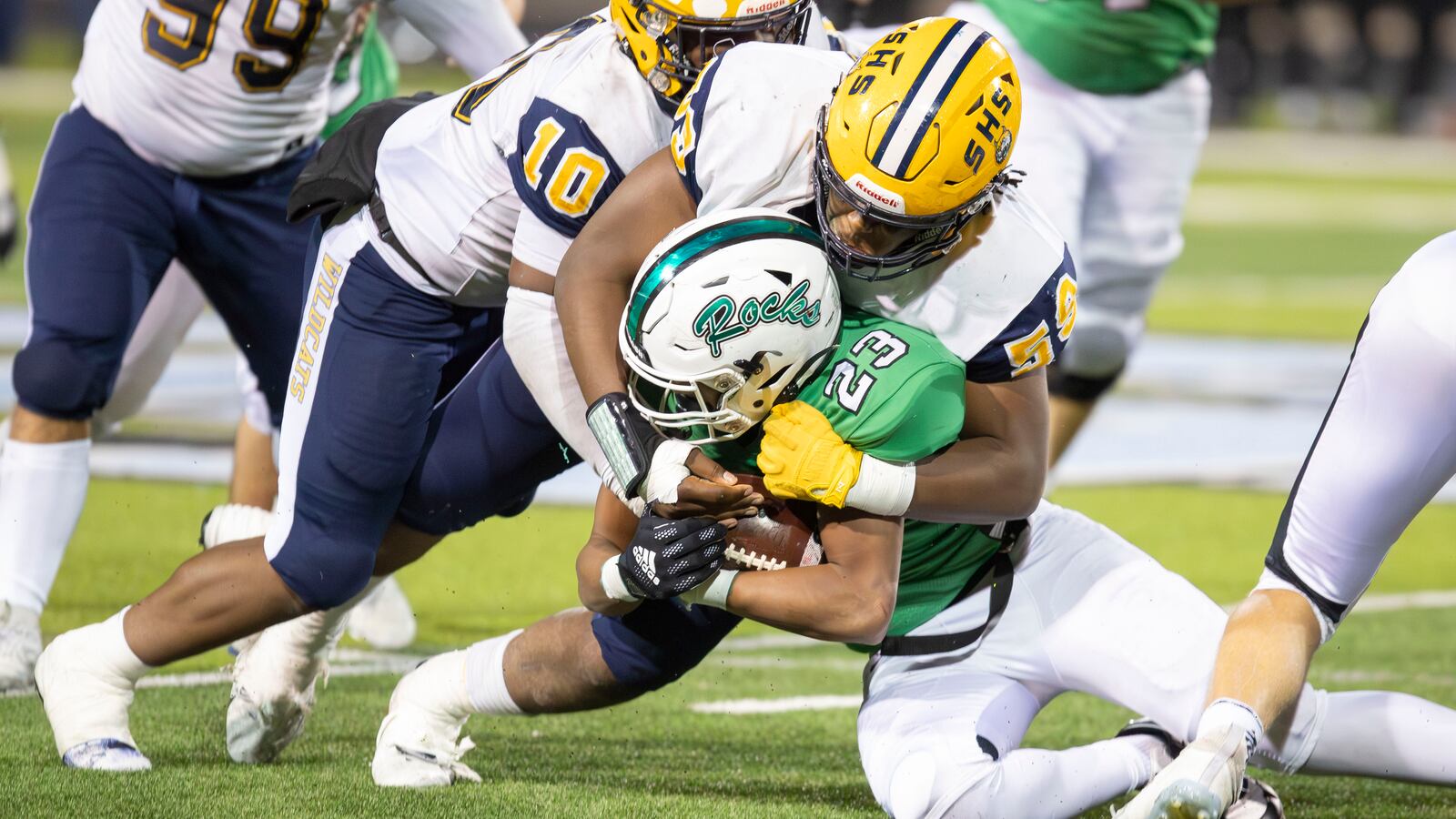 Springfield High School sophomore Royce Rogers tackles Dublin Coffman junior Daven White during the Division I, Region 2 championship game on Friday night at Hilliard Darby Stadium. The Wildcats won 21-14. Michael Cooper/CONTRIBUTED