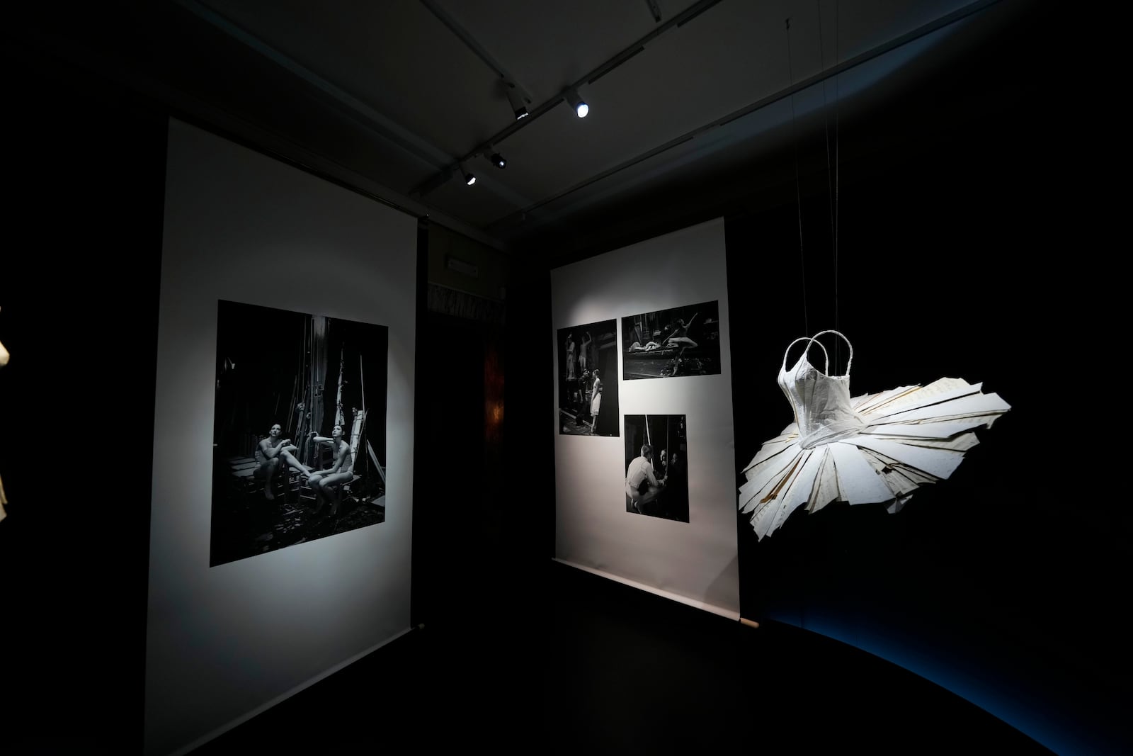 Pictures are displayed during the unveiling of the photo exhibition 'Lo sguardo nascosto' ( The hidden gaze) by photographer Gerard Uferas, at the La Scala Opera House in Milan, Italy, Tuesday, Feb. 11, 2025. (AP Photo/Luca Bruno)