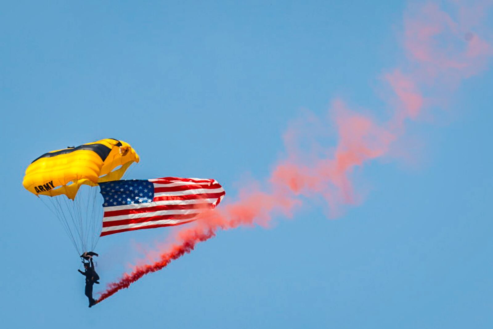 A member of the United States Army Parachute Team, also known as the Golden Knights, opens the 50th Dayton Air Show on Saturday, June 22, 2024. Jim Noelker / Staff