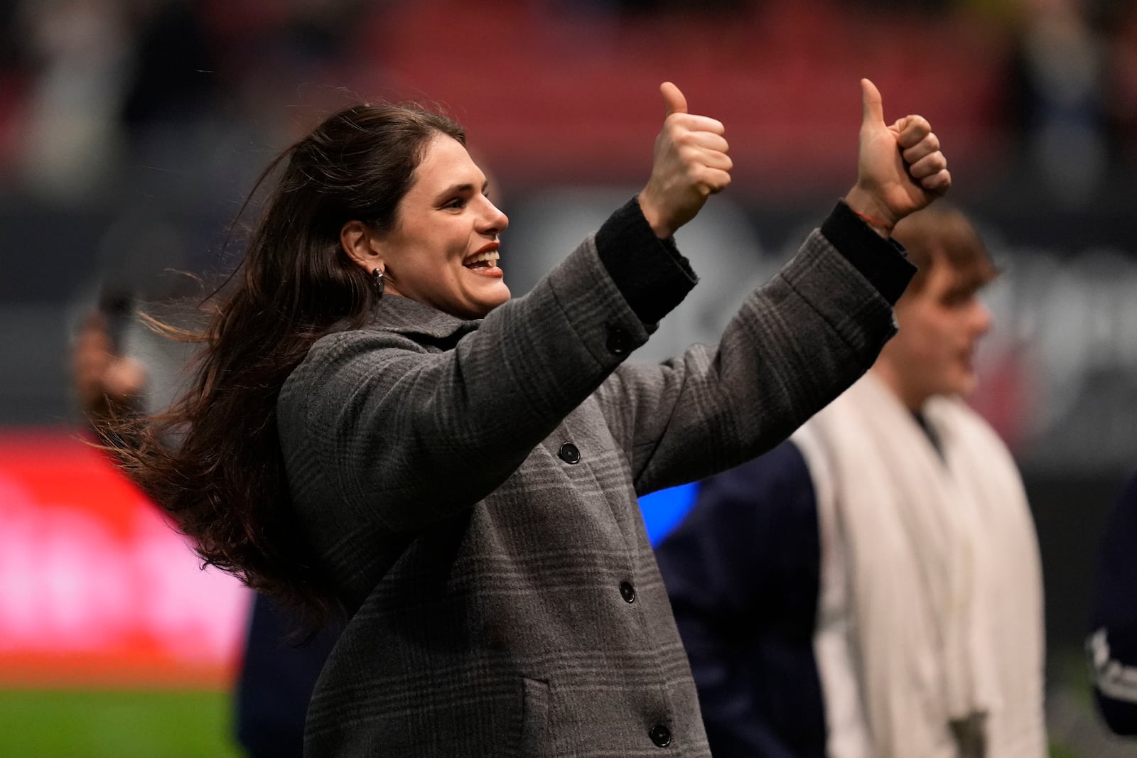 Bristol Bears' Ilona Maher gestures as she walks on the pitch at half time during the Champions Cup rugby union match at Ashton Gate, Bristol, England, Sunday Dec. 8, 2024. (Andrew Matthews/PA via AP)