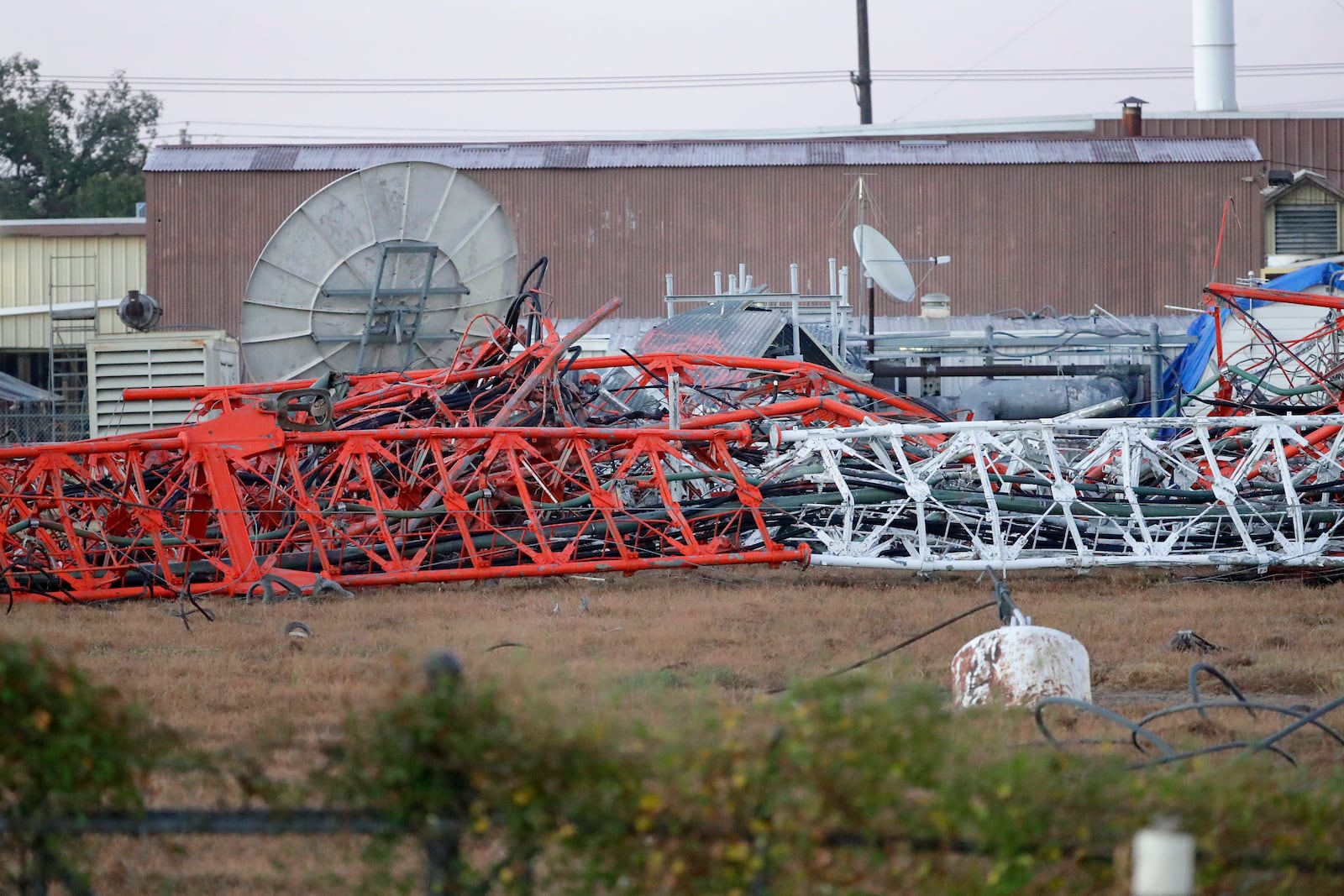 A view from the north side of the collapsed radio tower where a helicopter collided with the structure, killing all aboard Monday, Oct. 21, 2024 in Houston. (Michael Wyke/Houston Chronicle via AP)