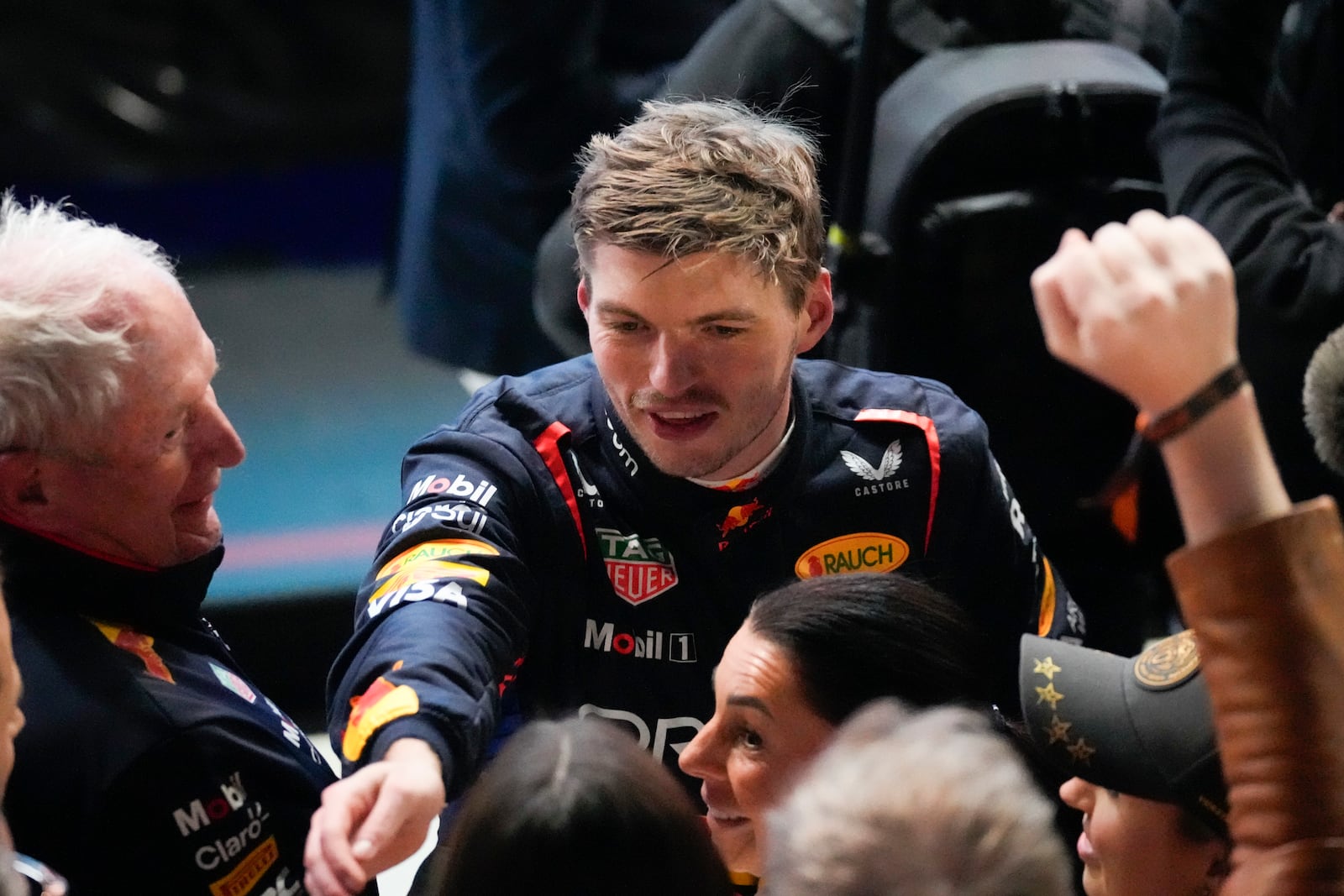 Red Bull driver Max Verstappen of the Netherlands celebrates after winng the Qatar Formula One Grand Prix at the Lusail International Circuit in Lusail, Qatar, Sunday, Dec. 1, 2024. (AP Photo/Darko Bandic)