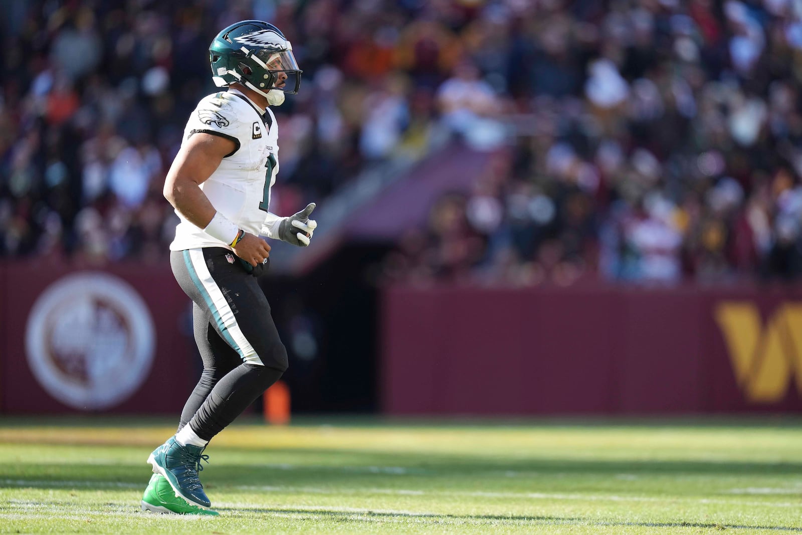 Philadelphia Eagles quarterback Jalen Hurts (1) walking off the field during the first half of an NFL football game against the Washington Commanders, Sunday, Dec. 22, 2024, in Landover, Md. (AP Photo/Stephanie Scarbrough)