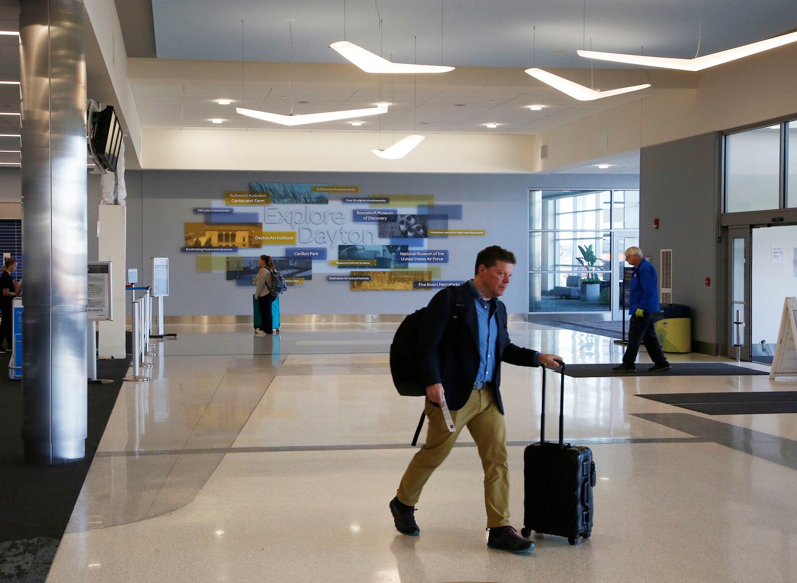 Renovation to the check-in area of the Dayton Airport terminal has been completed with a new terrazzo floors, full glass and steel exterior with a glass canopy to bring more natural light into the terminal. TY GREENLEES / STAFF