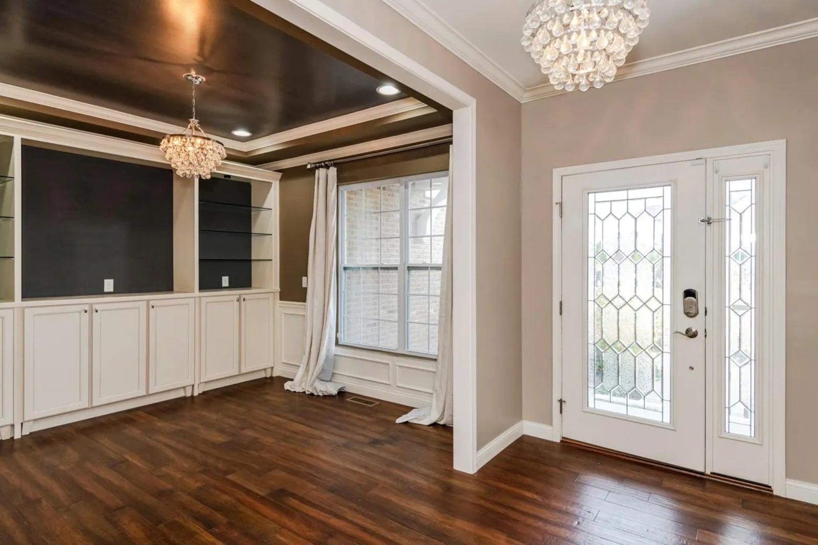 A formal entry opens into a foyer hallway with an office or study just off to the right. CONTRIBUTED