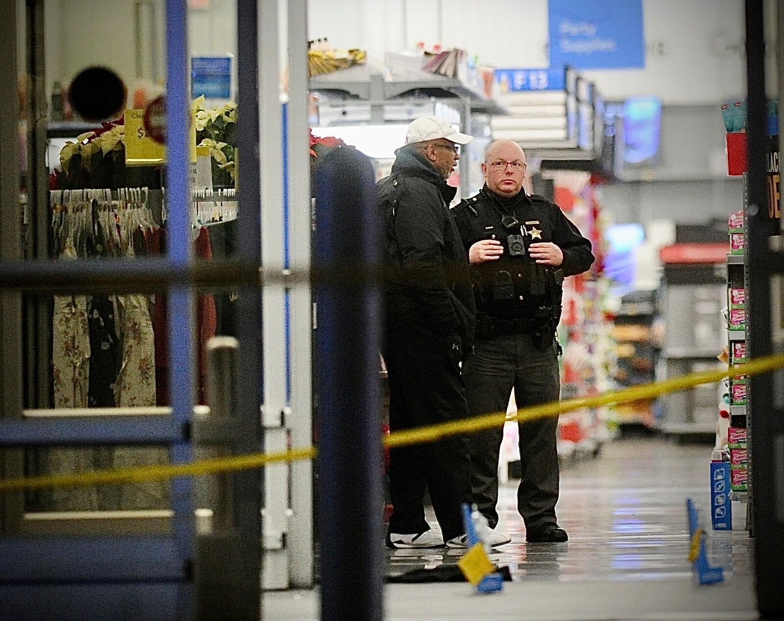 Police respond to the scene of a shooting on Monday, Nov. 20, 2023 in Beavercreek, Ohio. Police say a shooter opened fire at a Walmart, wounding four people before apparently killing himself. The attack took place Monday night at a Walmart in Beavercreek, in the Dayton metropolitan area. (Marshall Gorby/Dayton Daily News via AP)