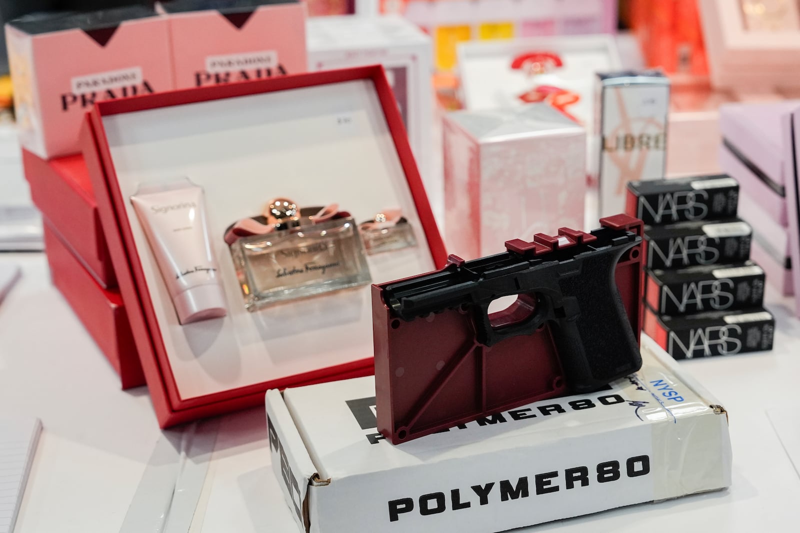 Stolen merchandise is displayed during a press conference on an international stolen merchandise ring, Tuesday, Nov. 26, 2024, in the Queens borough of New York. (AP Photo/Julia Demaree Nikhinson)