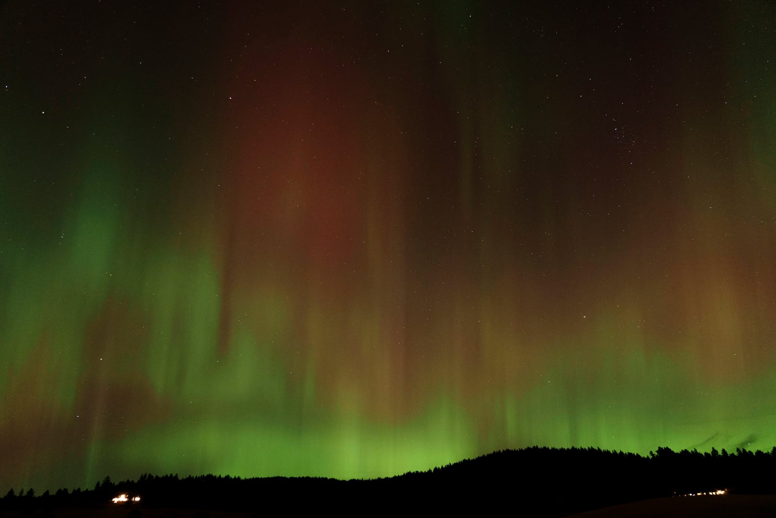 FILE - An aurora borealis, also known as the northern lights, is seen in the night sky on Thursday, Oct. 10, 2024, in Moscow, Idaho. (AP Photo/Ted S. Warren, File)