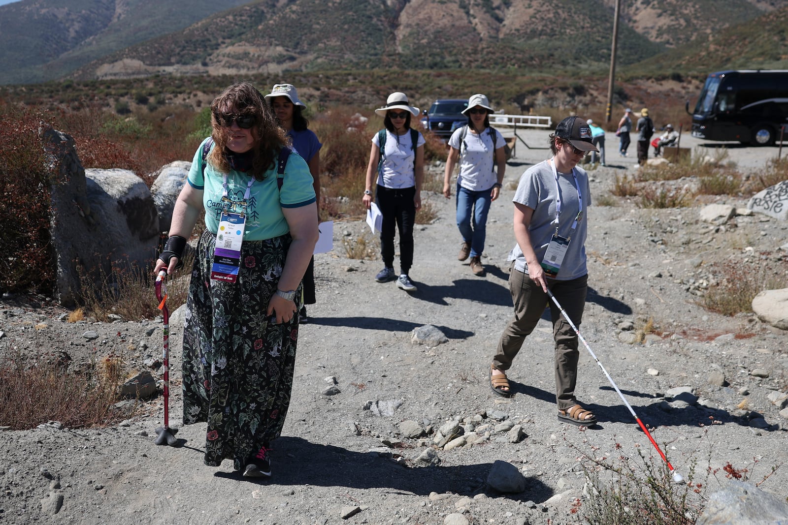 Attendees walk during an accessible field trip to the San Andreas Fault organized by the International Association of Geoscience Diversity Thursday, Sept. 26, 2024, in San Bernadino, Calif. (AP Photo/Ryan Sun)