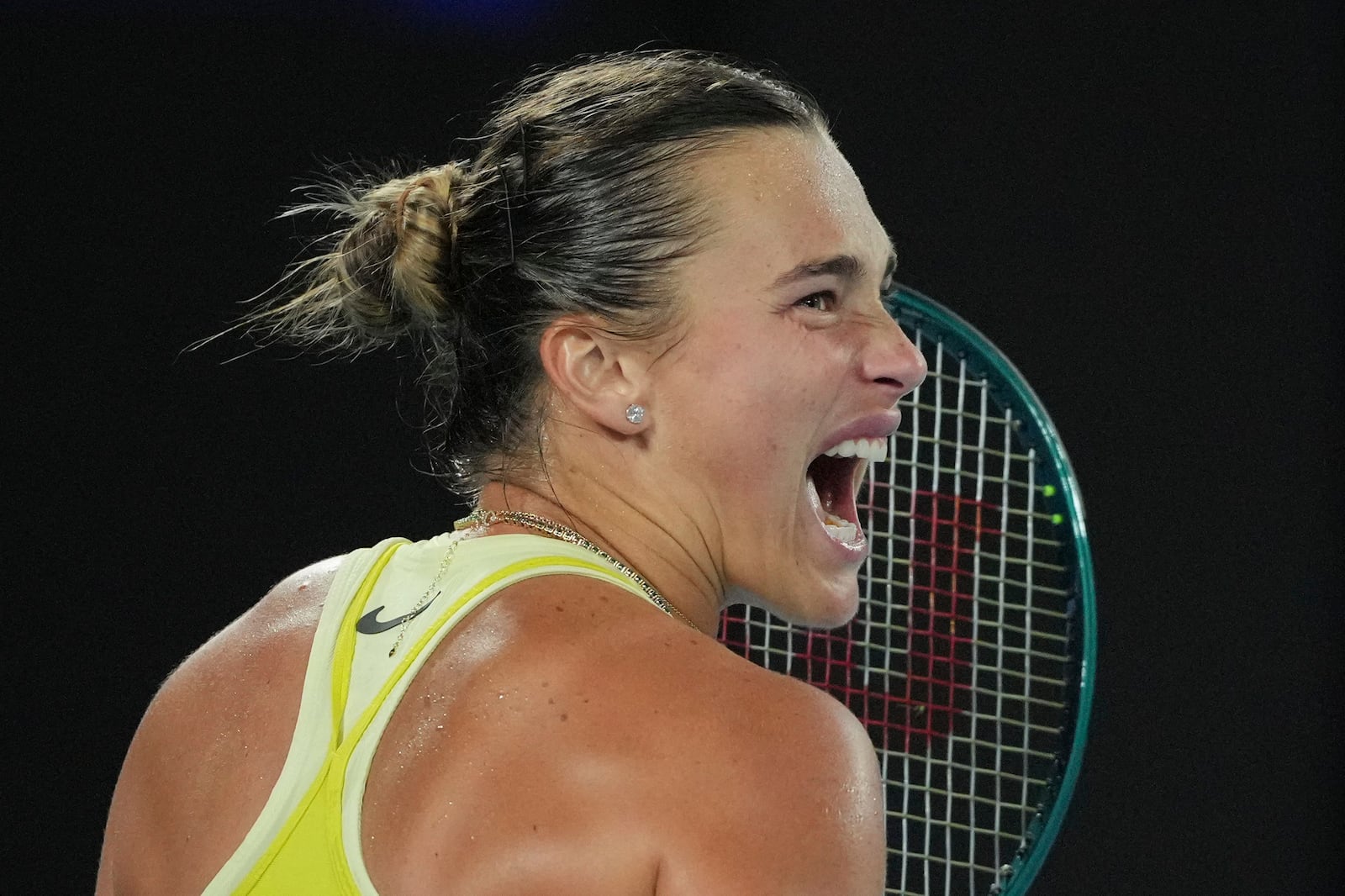 Aryna Sabalenka of Belarus reacts during the women's singles final against Madison Keys of the U.S. at the Australian Open tennis championship in Melbourne, Australia, Saturday, Jan. 25, 2025. (AP Photo/Vincent Thian)